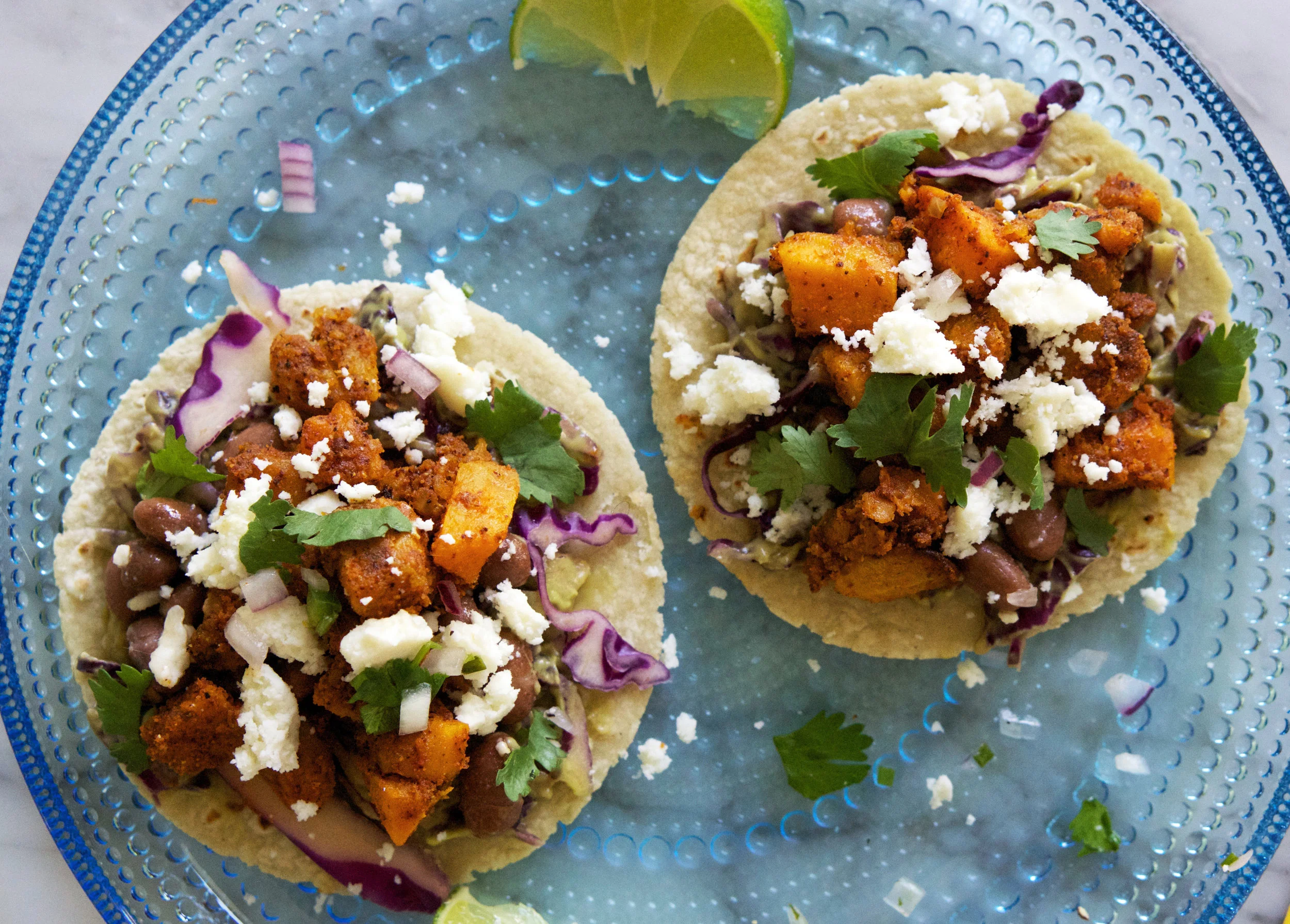 Butternut Squash & Pinto Bean Tacos with Creamy Avocado Slaw