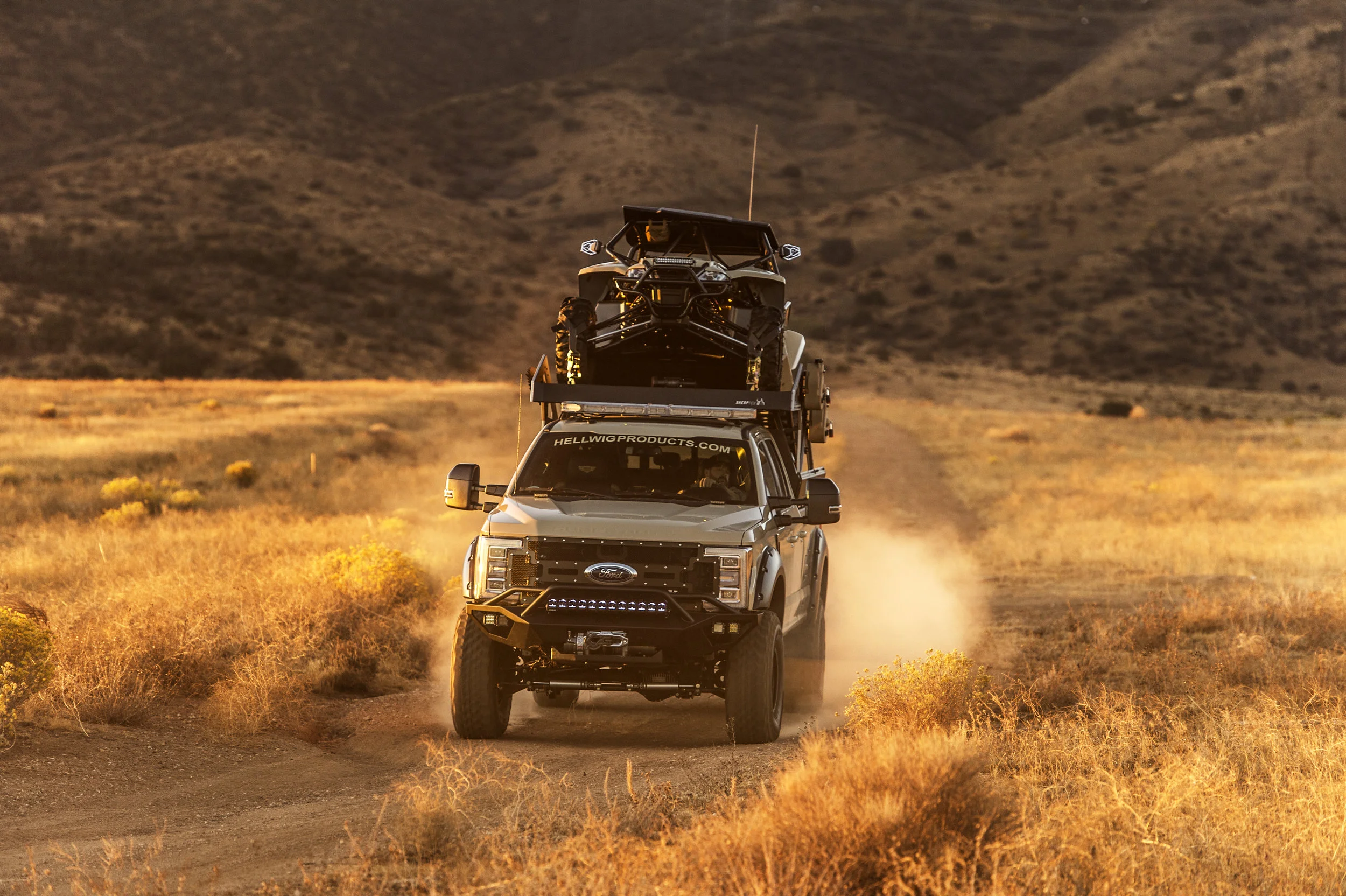 A toy hauler that attaches to our modular truck bed that gives you an upper deck over the cab for ATVs, roof top tents or additional storage.
