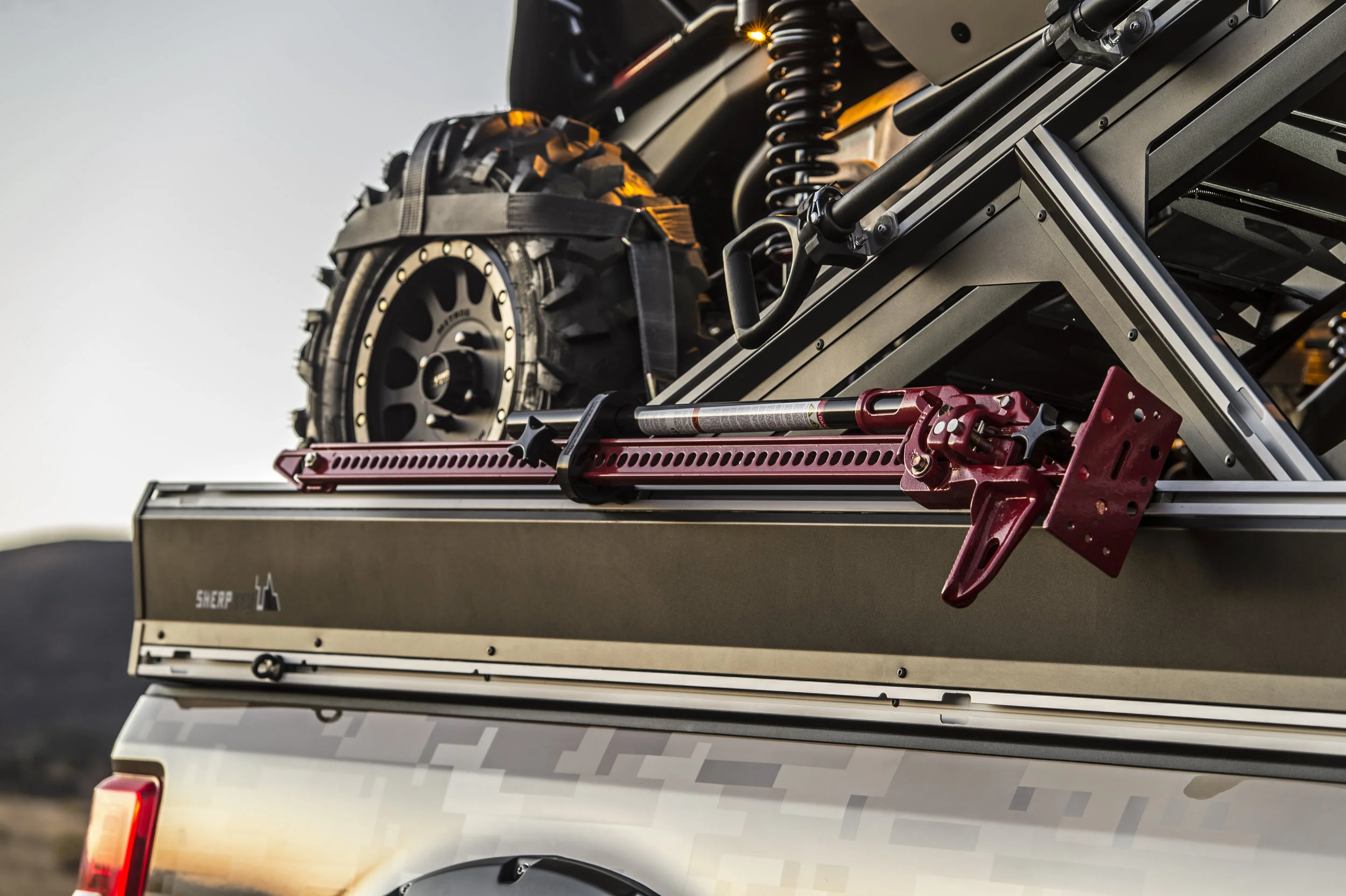 A toy hauler that attaches to our modular truck bed that gives you an upper deck over the cab for ATVs, roof top tents or additional storage.