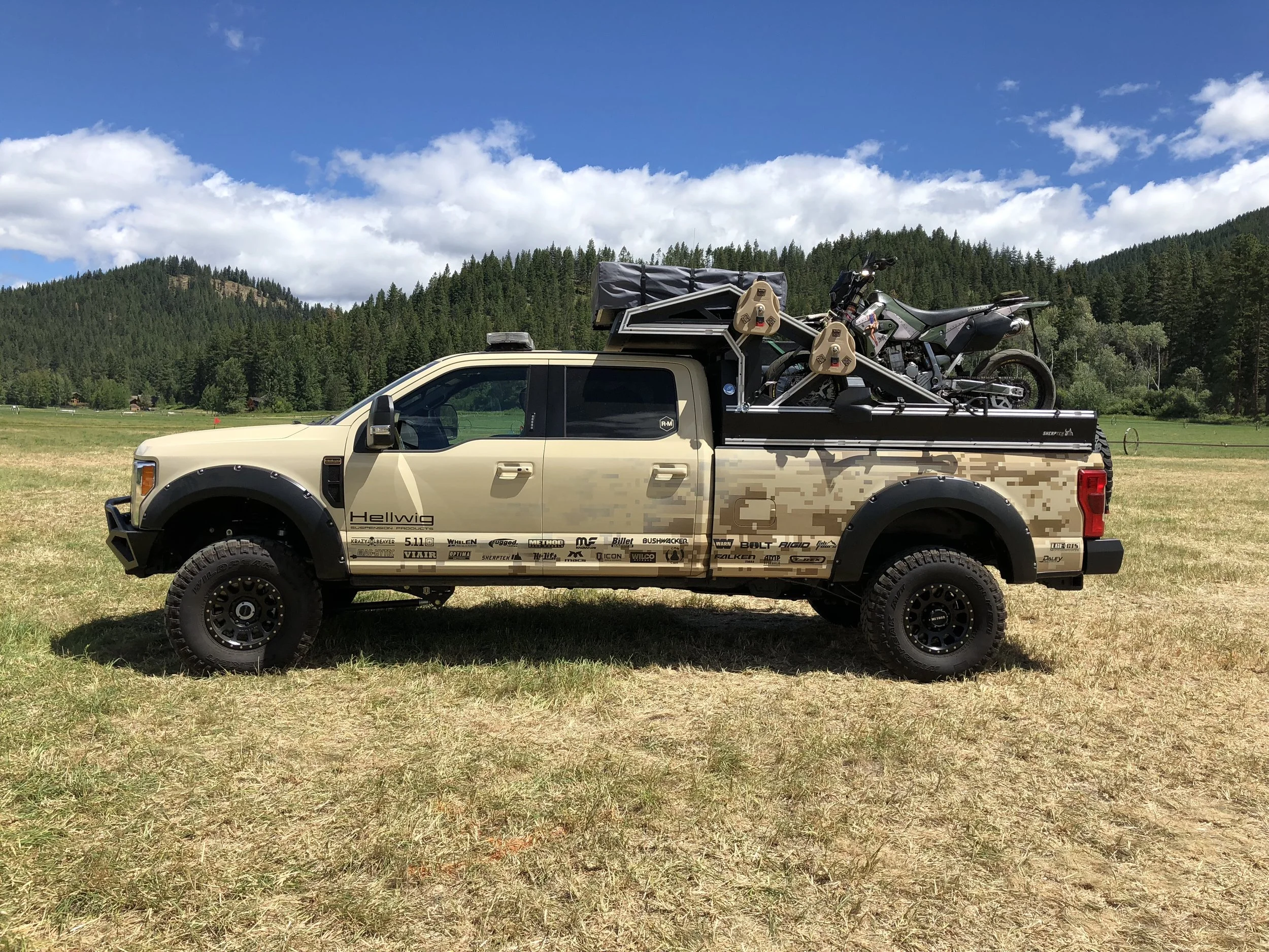 A toy hauler that attaches to our modular truck bed that gives you an upper deck over the cab for ATVs, roof top tents or additional storage.