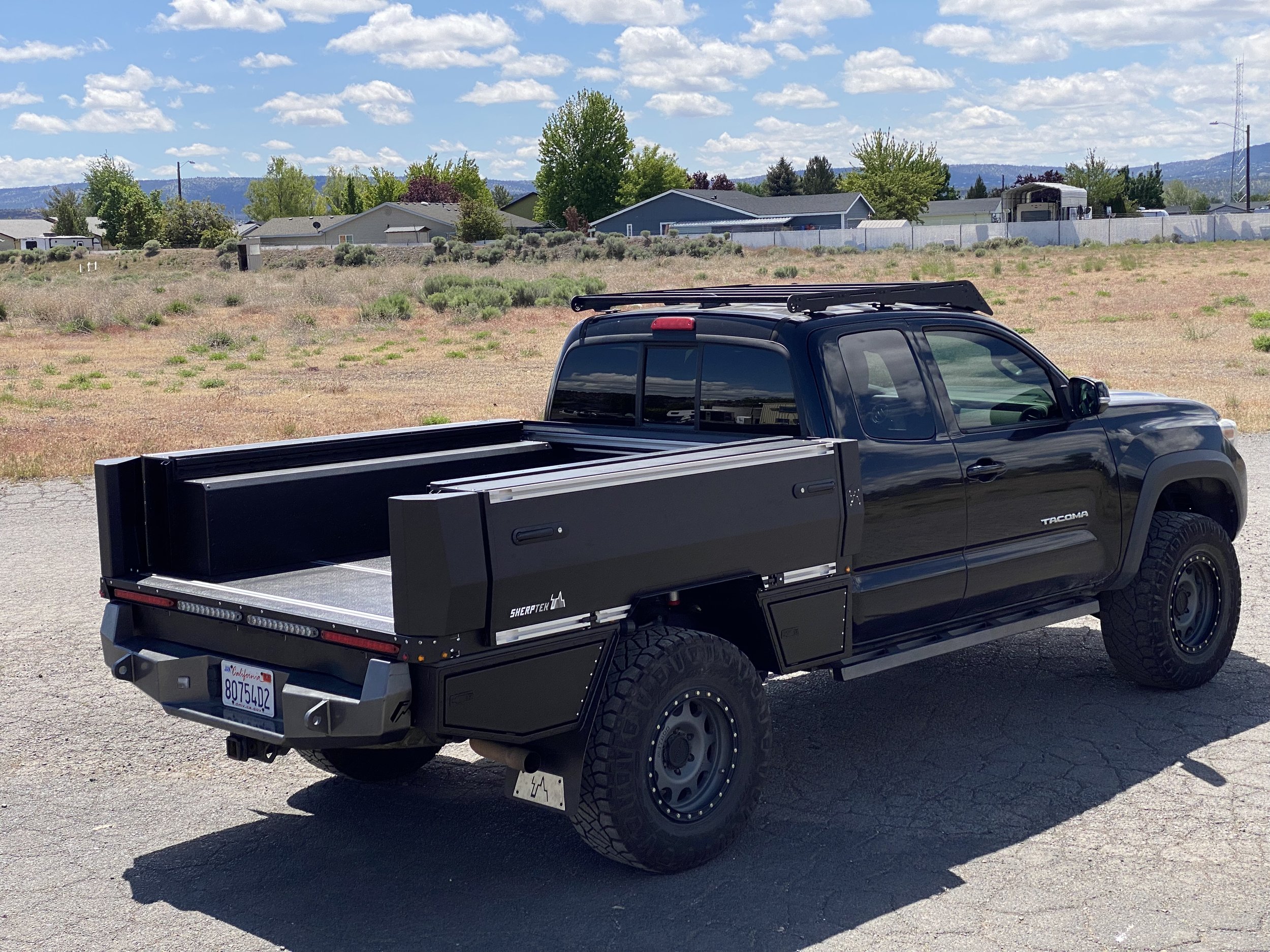 Boxes on top and underneath the flatbed.