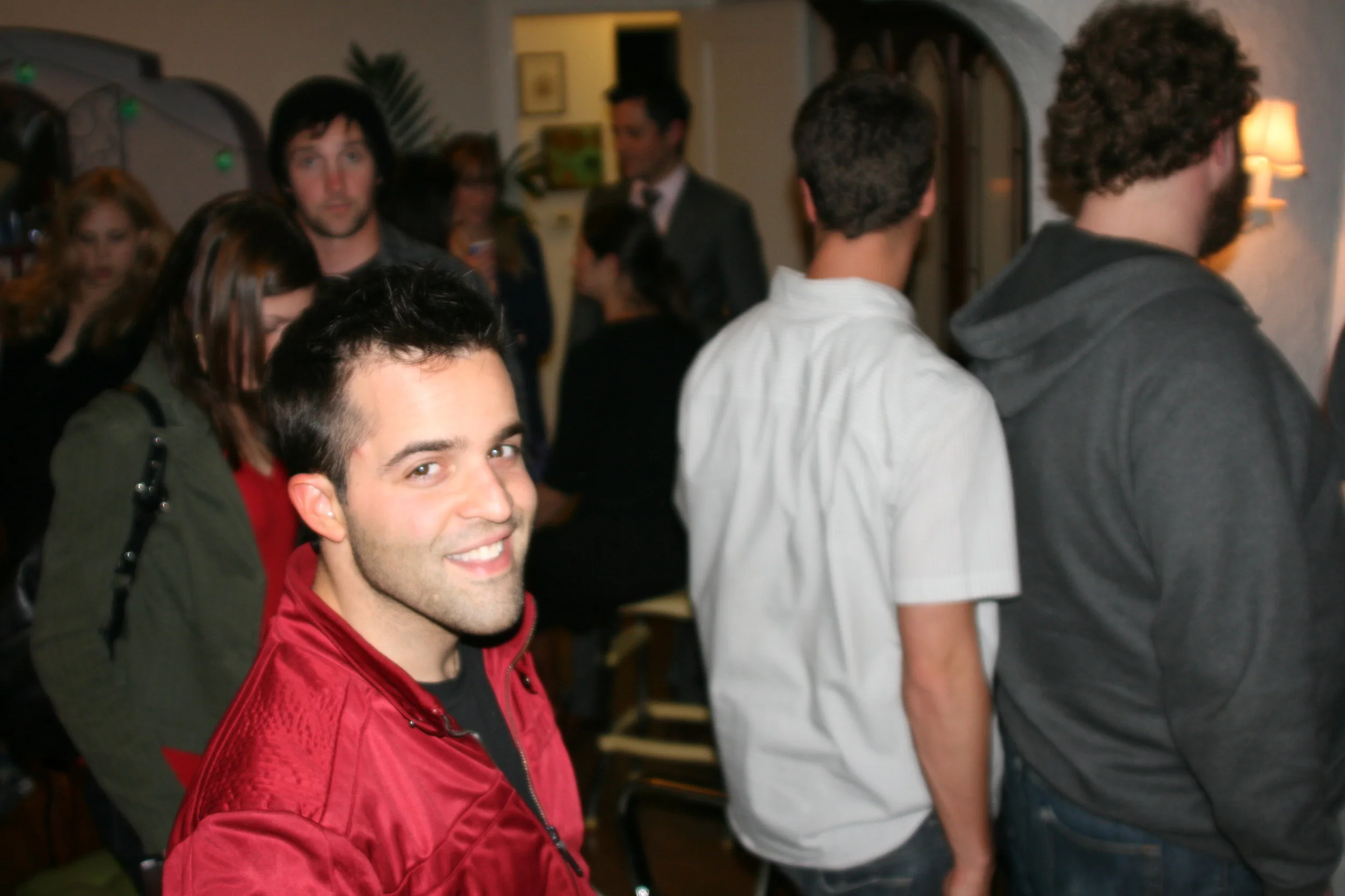 Party guests enjoying themselves… (check out the blue globe lights in the background- sweet!)