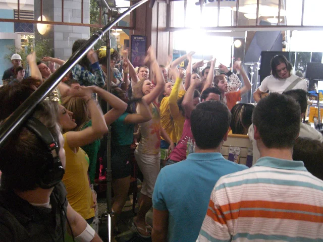 A behind-the-scenes shot of the kids rockin it out in the music shop
