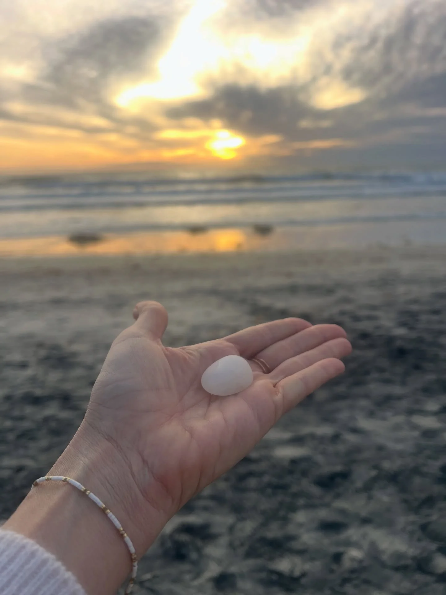 I was walking on the beach in my hometown over the holidays, deep in thought and revelation, when I looked down and saw this perfect little white rock. 

Not one like it anywhere else on the beach. 

A little egg. 
A symbol of things about to crack o
