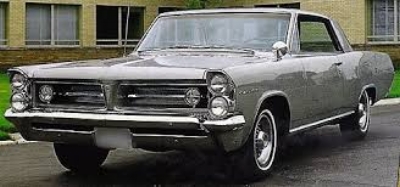 WITH THE 1963 GRAND PRIX , Pontiac OFFERED AN ELEGANT RESPONSE TO THE FORD THUNDERBIRD. ITS 8-BOLT ALLoY WHEELS, FINNED ALUMINUM BRAKES, BUCKET SEATS, FULL INSTRUMENTATION, along with A REFRESHING LACK OF BODY ORNAMENTATION, CAUSED ONE COMMENTATOR TO DEScRIBE the GP's LOOKS as "AN ATHLETE IN A TUXEDO." ( www.pontiacserver.com