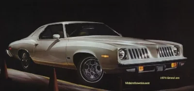 The name of the 1973 Pontiac Grand Am says it all: a cross between a luxury grand prix and a sporty Trans am. It was probably the most beautifully espressive American car of a decade not known for beauty and expression. (Pontiac advert Circa 1974)