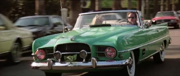 The Dual-Ghia's connection to Hollywood, if not washington, endured. This one had a role in 1987s Beverley Hills Cop II. it was not likely wearing a factory paint job ( www.imcdb.com )