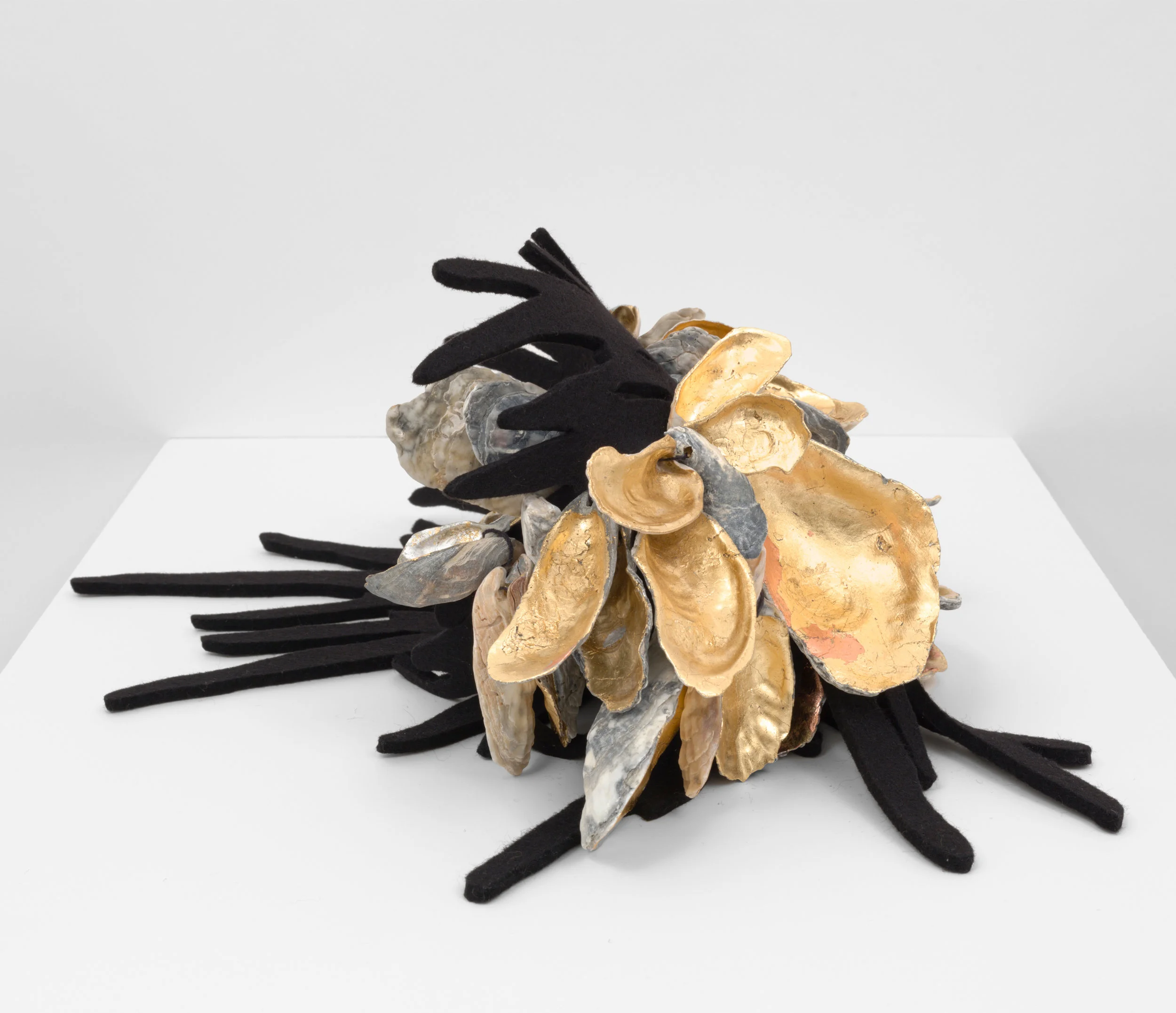 Seaweed 1, 2018, felt, oyster shells, and gold leaf, 7.5H x 18.5W x 19D inches