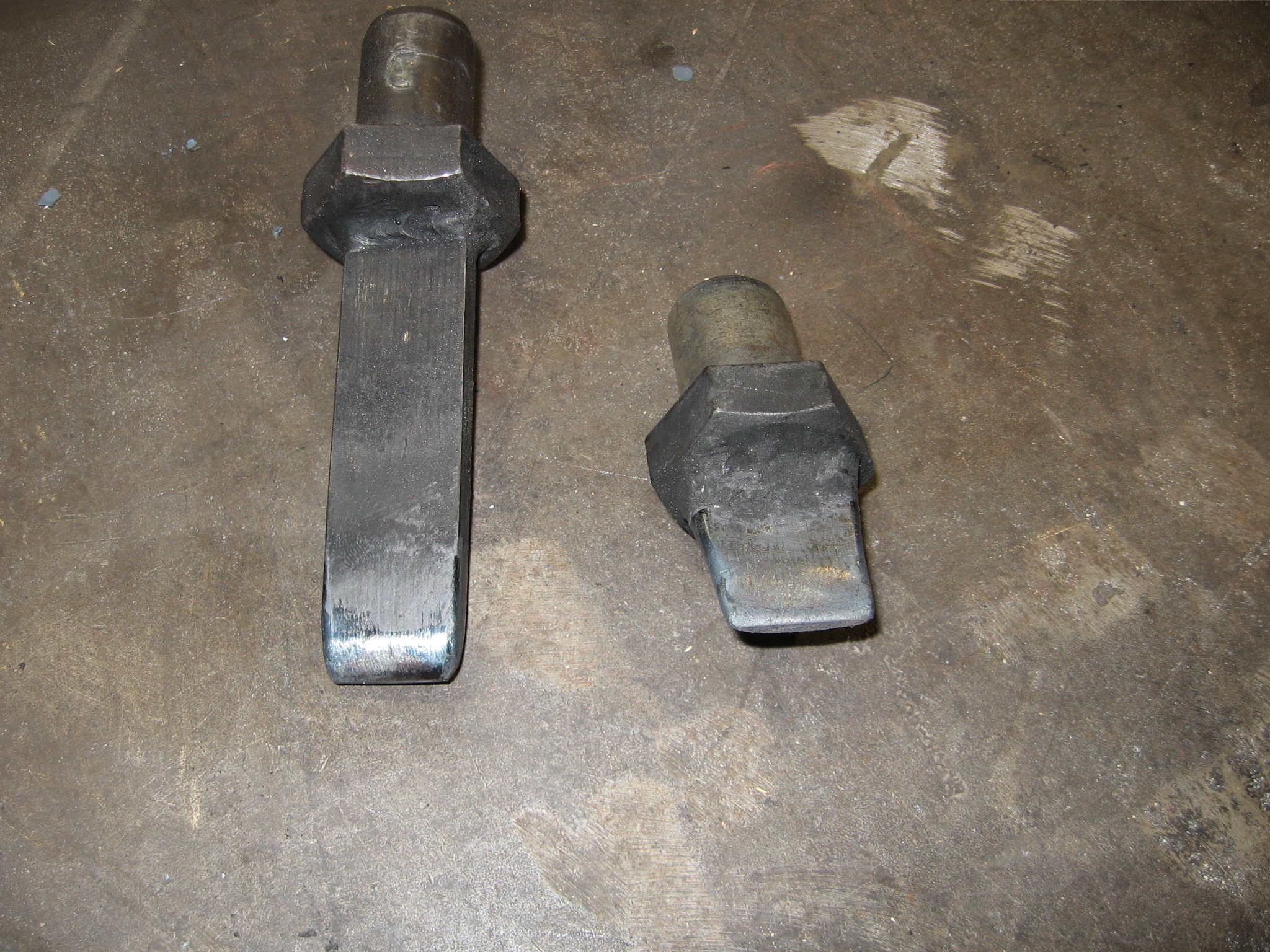 Slitting and Drifting Tools The shorter chisel does not come to a sharp knife edge. This is done to avoid the edge rolling over when hot. We recommend H-13 tool steel for these.