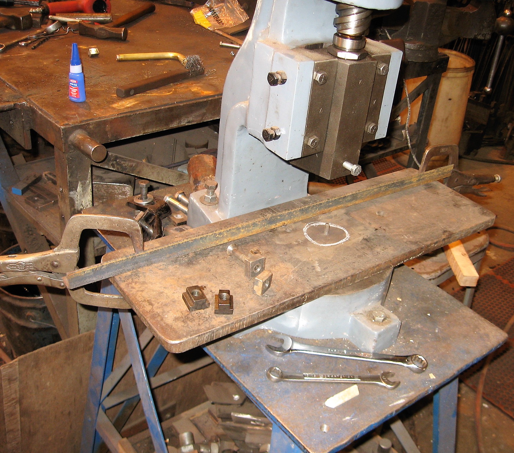 This photo shows the hardware we use to attach this base plate. By using countersunk bolts in the T slots you can have a clean top surface which allows you to clamp a fence in any position.
