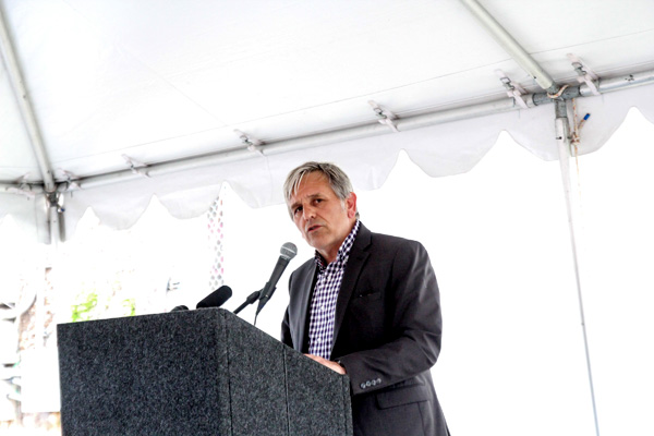Photo by Mujale Chisbuka: Capitol Hill Housing CEO Chris Persons gives remarks during the groundbreaking.