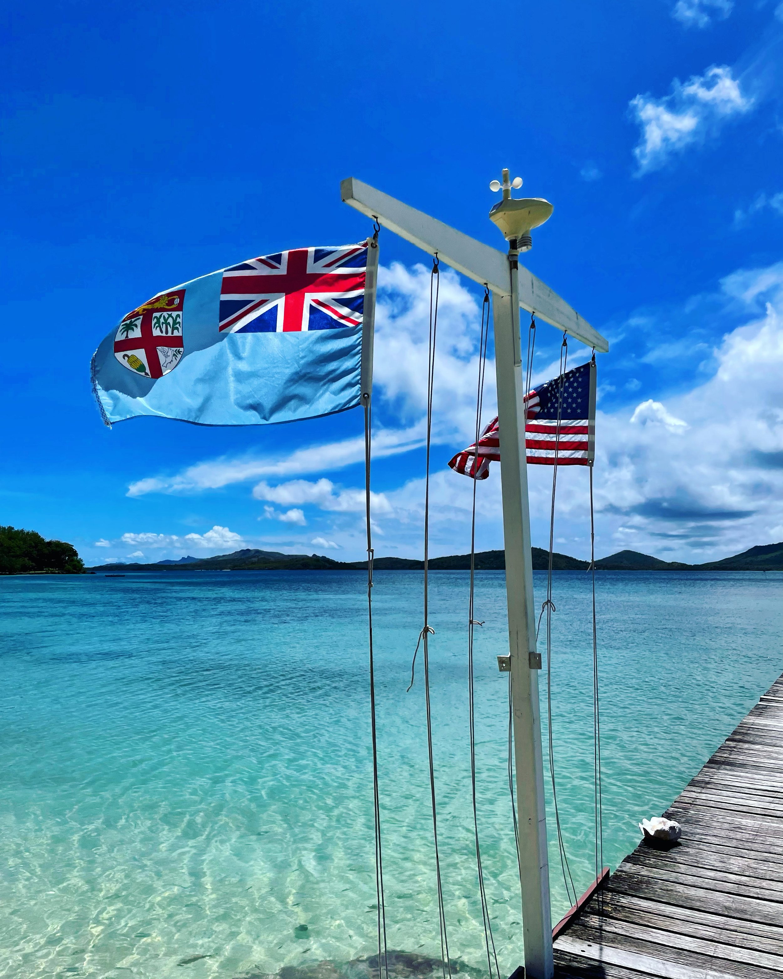 Copy of American and Fijian flags fly above the dock at Turtle Fiji Resort,.JPG