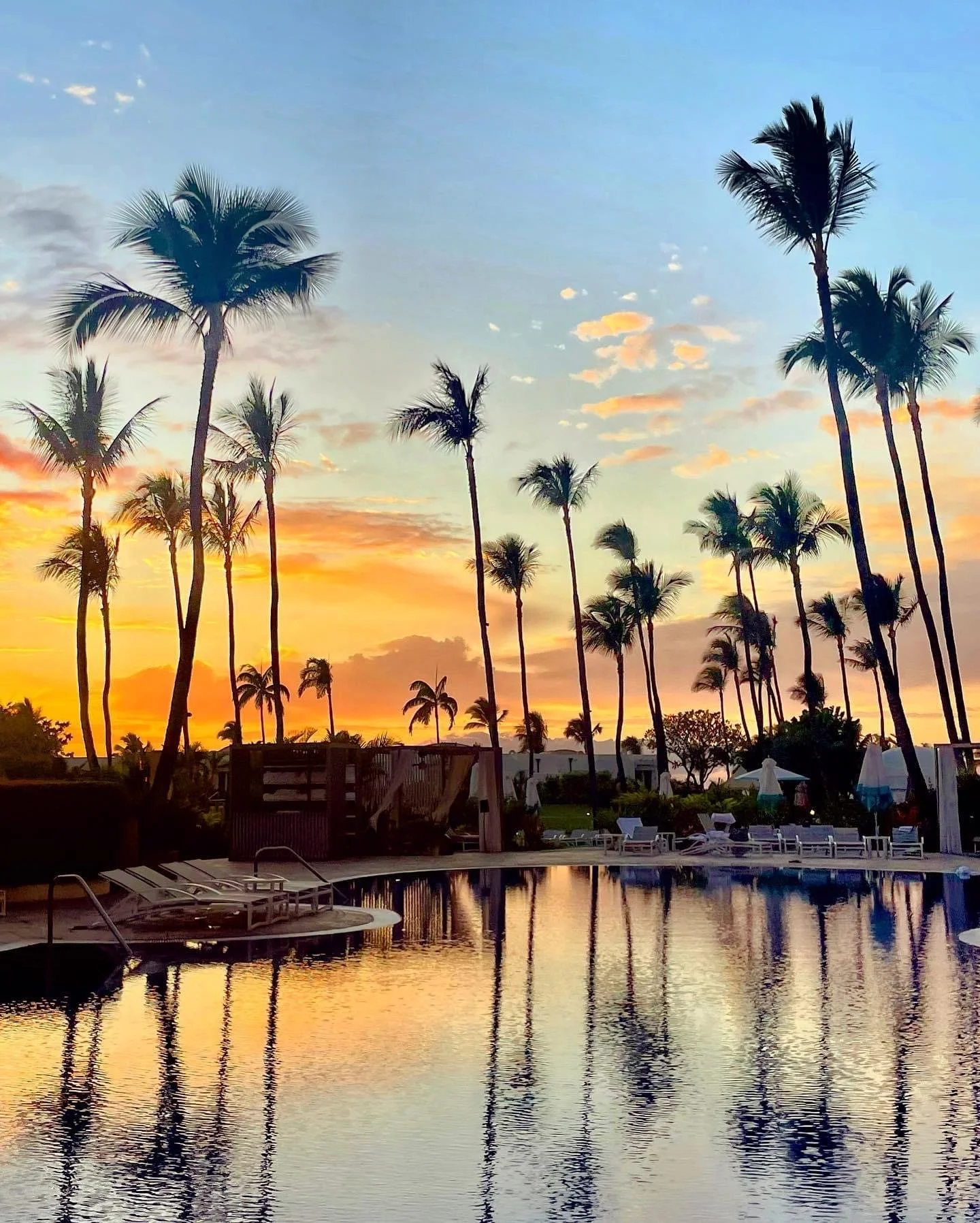 The pool is aglow before dusk at Fairmont Kea Lani in Wailea, Maui.JPG