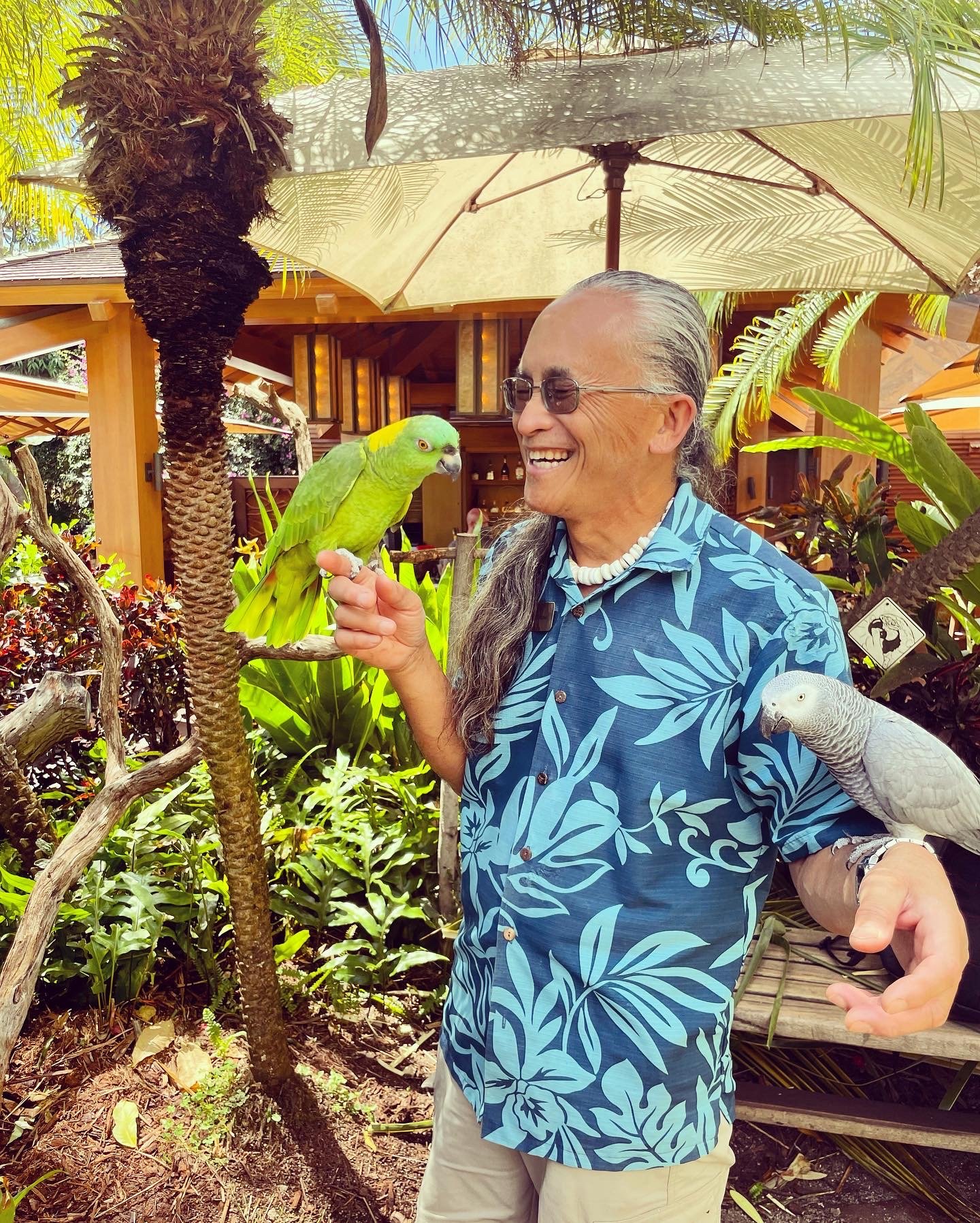 The bird whisperer in residence at Four Seasons Lanai shares a moment with his not-so-foul fowl.jpg