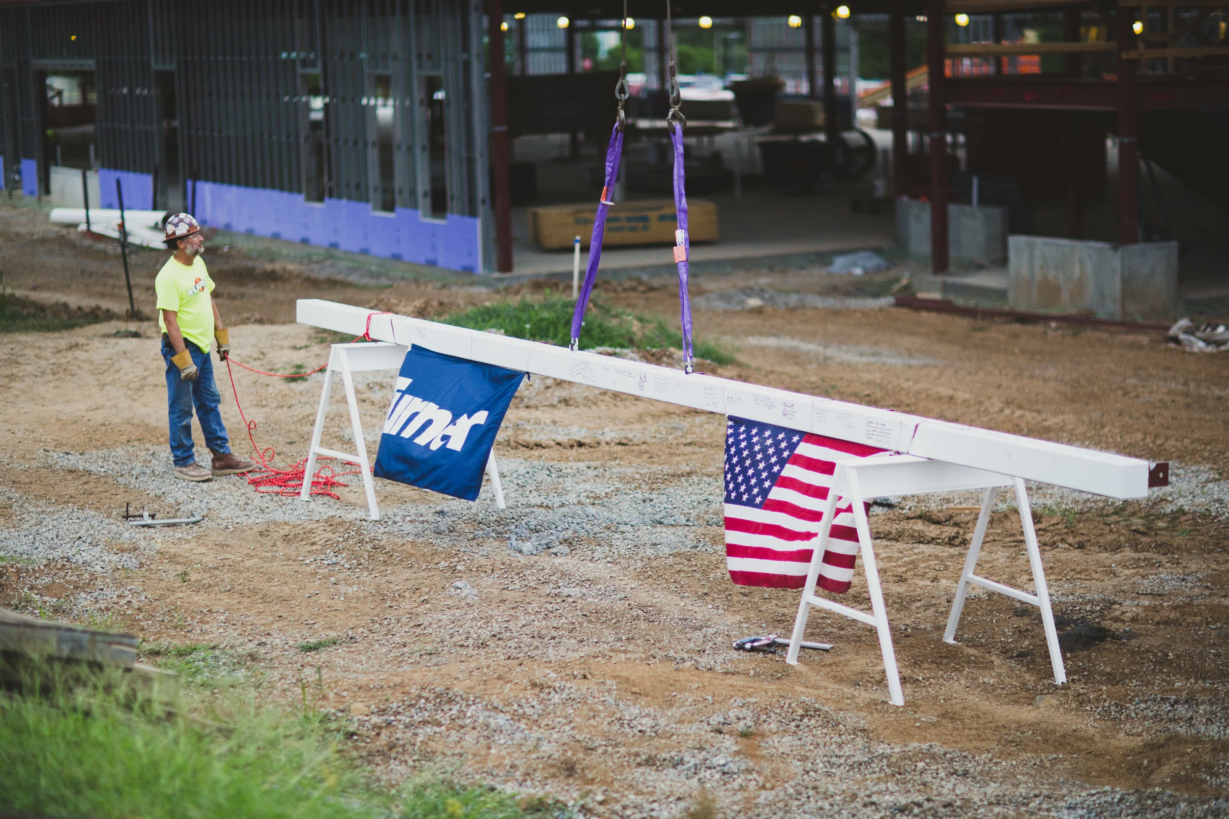 The B.E. Smith Family Center reached a major construction milestone on July 26, when crews lifted the final steel beam of the building's structure into place.