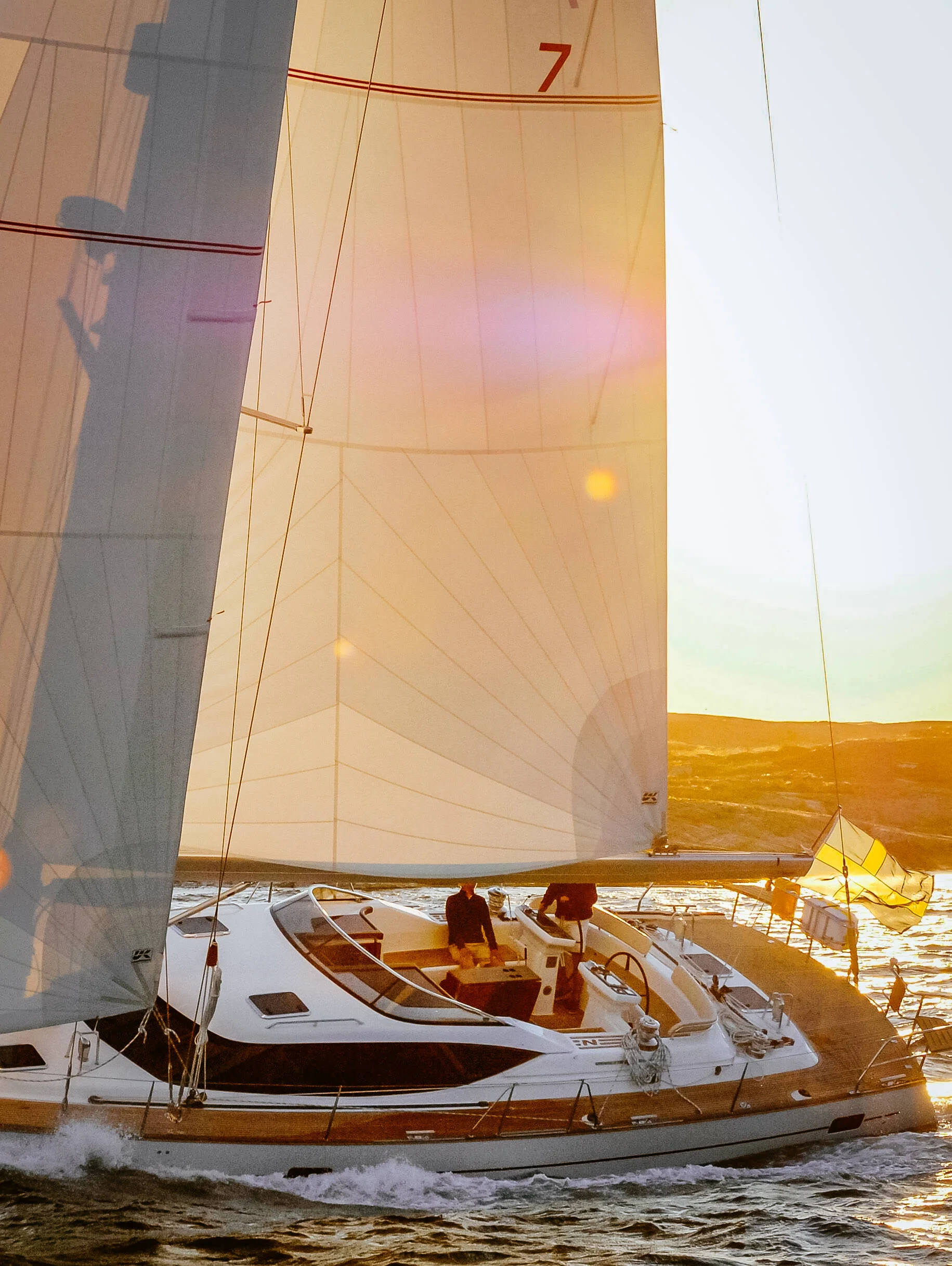 A Najad 570 with a tri-radial Spectra roller-furling performance cruising mainsail in the partially reefed position.