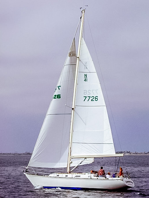 Boom furling mains are reefed to a full-length batten. Once the batten is rolled tight against the mandrel inside the boom, the sail’s reefed foot is pulled straight, which makes the foot flat for a well-reefed shape.