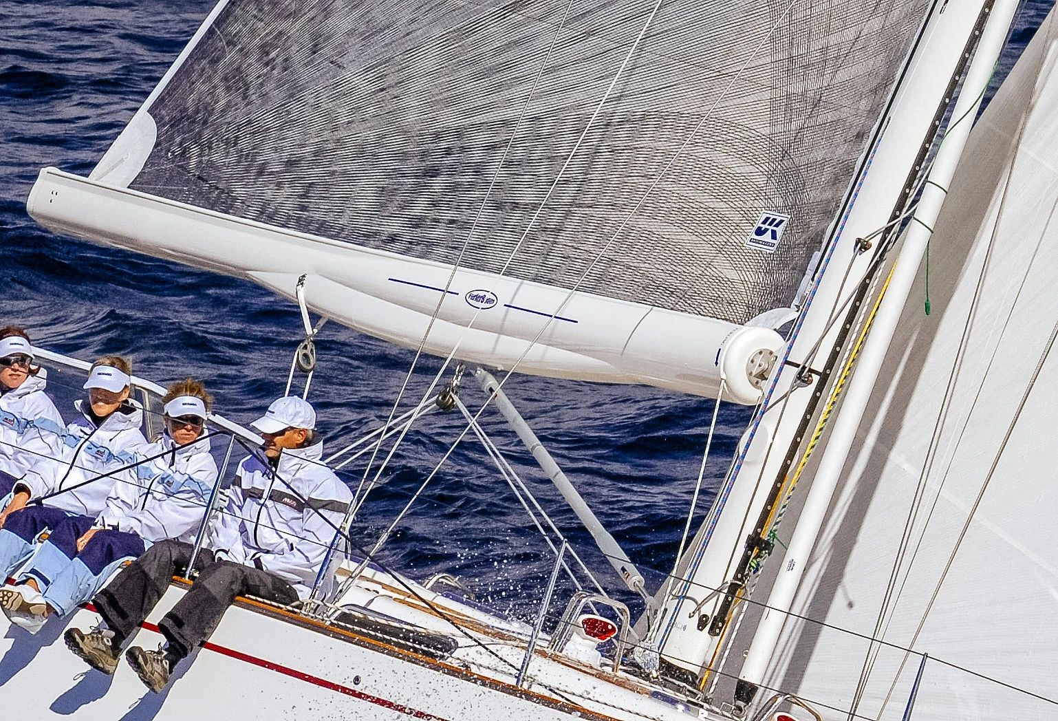 A close-up of a boom-furling mainsail. 