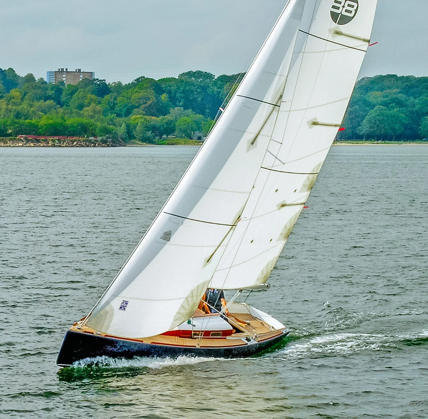 Modern classic daysailer with Dacron roller-furling jib and mainsail.