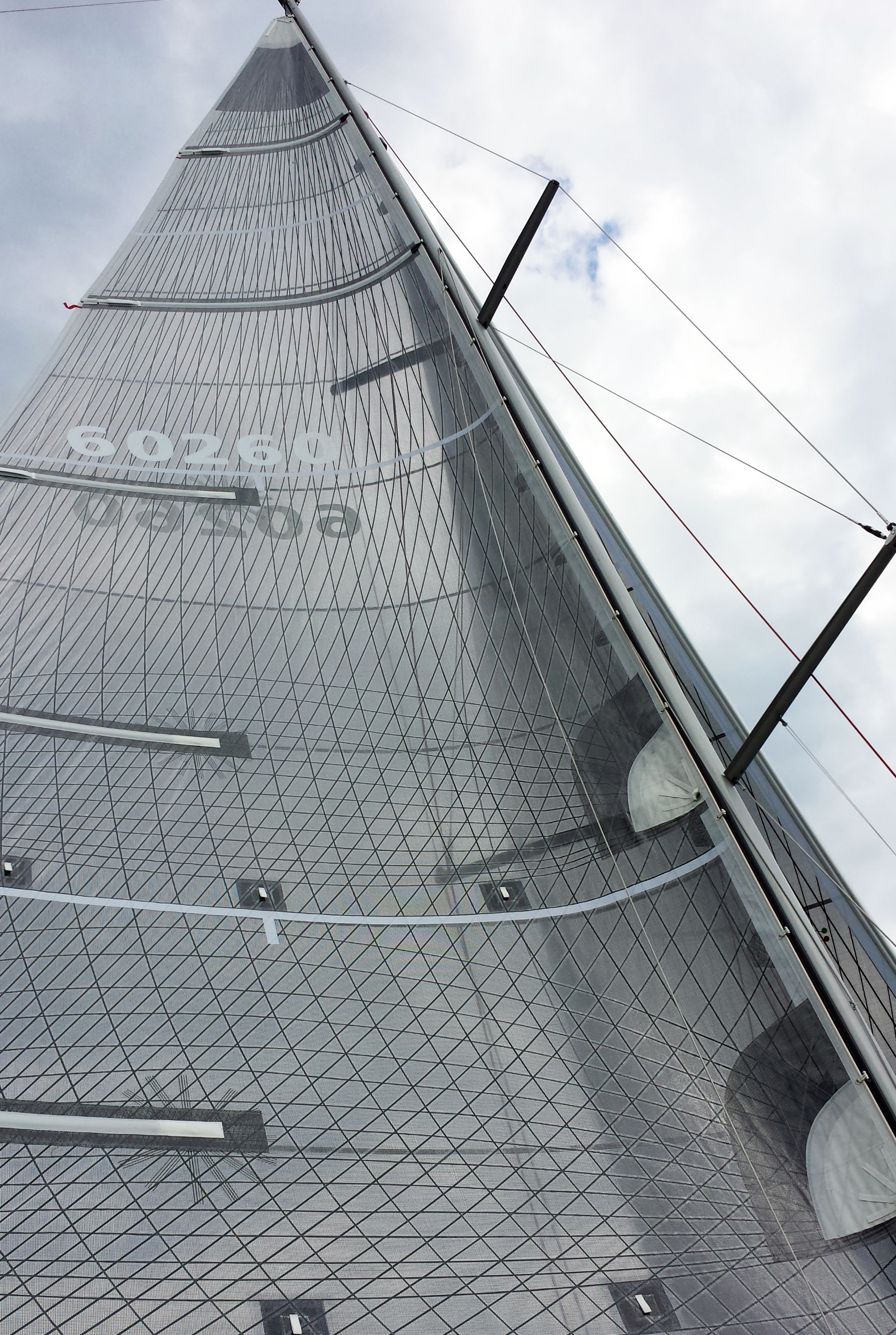 For sails with extra roach up high or lower aspect mainsails, UK Sailmakers offers the Powerhead with the two full-length battens. Shown above is a Tape-Drive Carbon Technora main with the top two battens being full length.