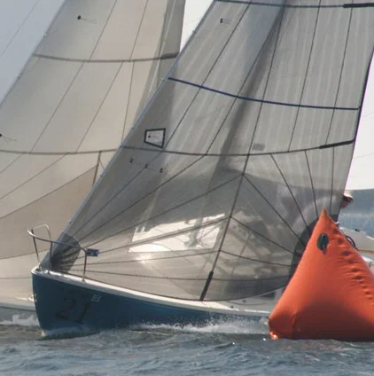 UK's racing genoa is a tri-radial construction made with either black aramid fibers or black polyester fibers.