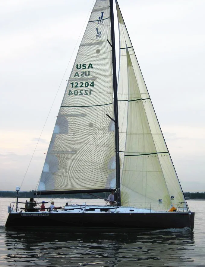 Above and to the right are images of the J/122 Christopher Dragon whose sail plan utilizes non-overlapping jibs. Even so, the Jib Top, with the same LP as the upwind jib, can overlap the mast. The close-reaching staysail inside the jib top makes a powerful reaching set up.