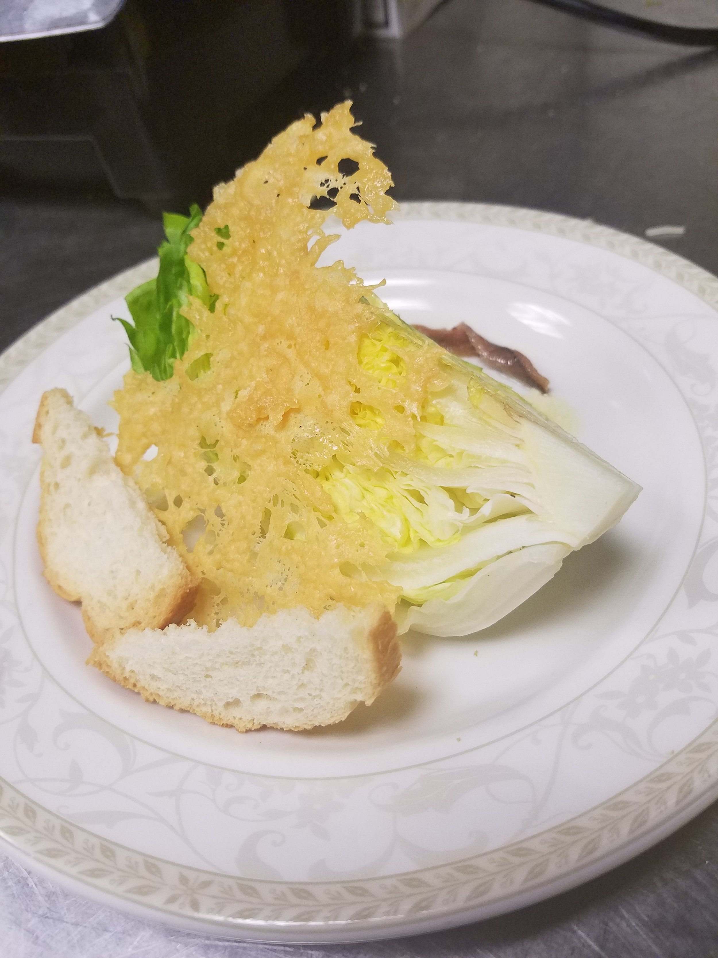 Show plate - Wedge Ceasar Salad with Asiago Crisp and Anchovie Garnish.jpg