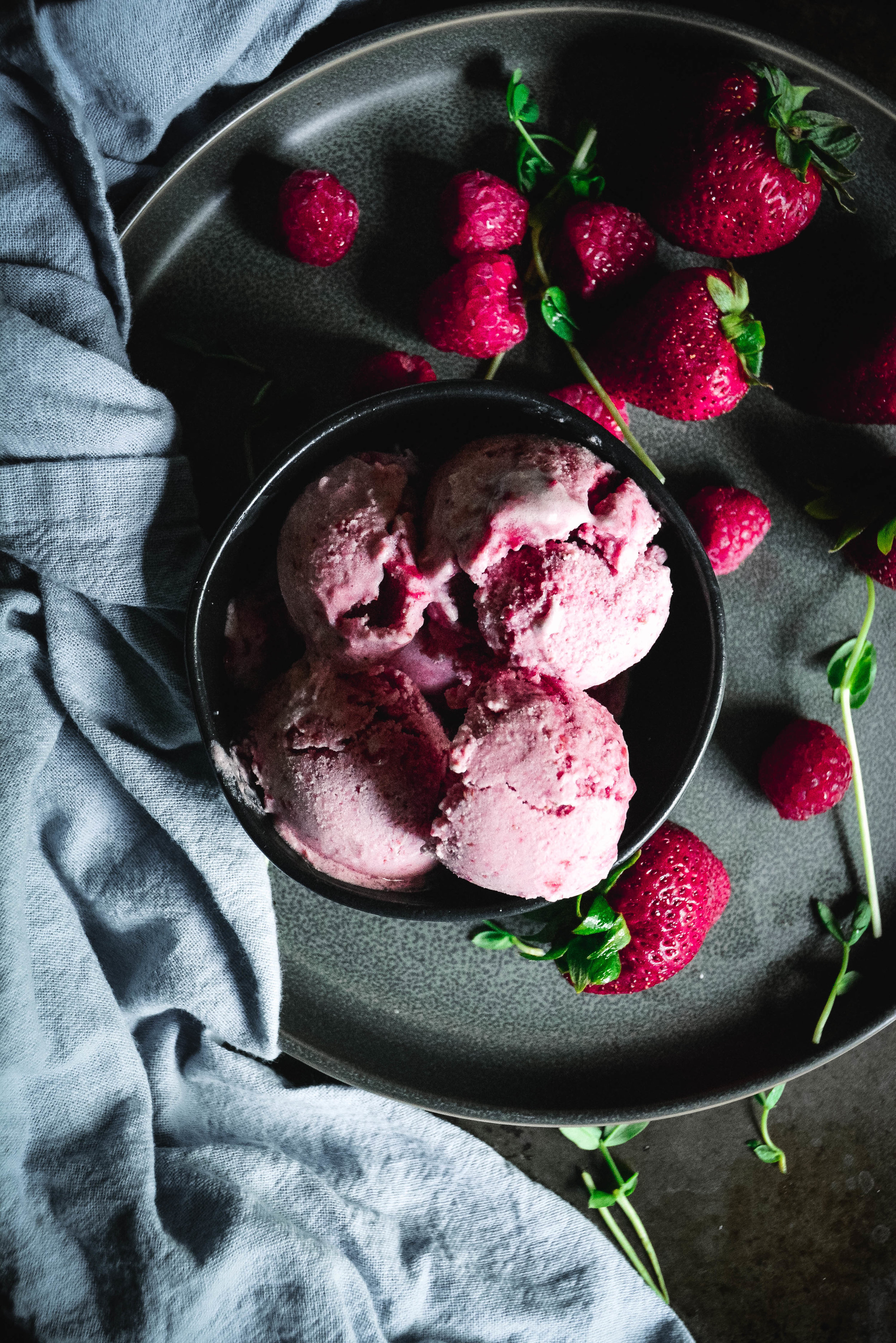 Paleo No-Churn Strawberry Ice Cream in bowl with strawberries
