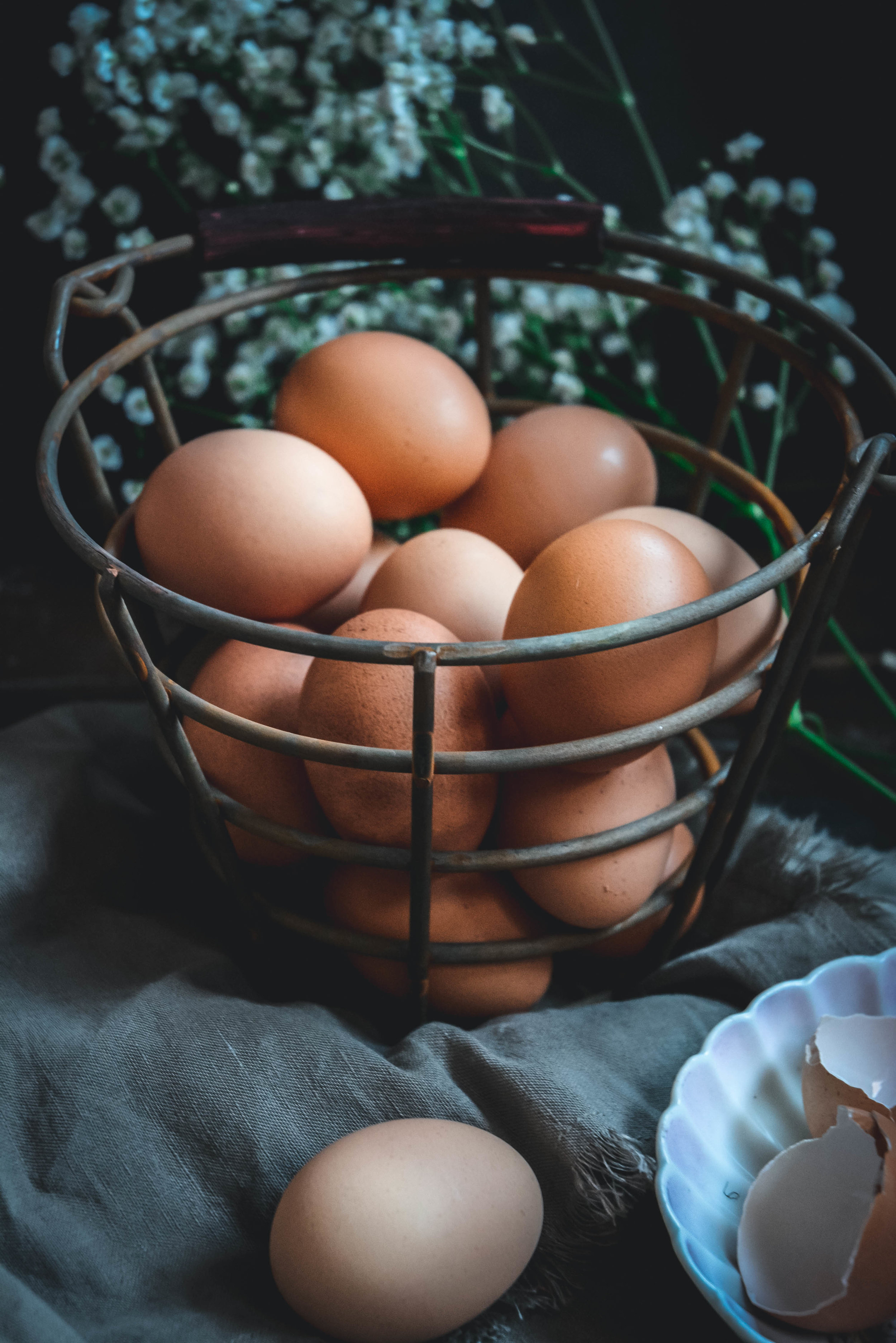 Eggs in basket on napkin