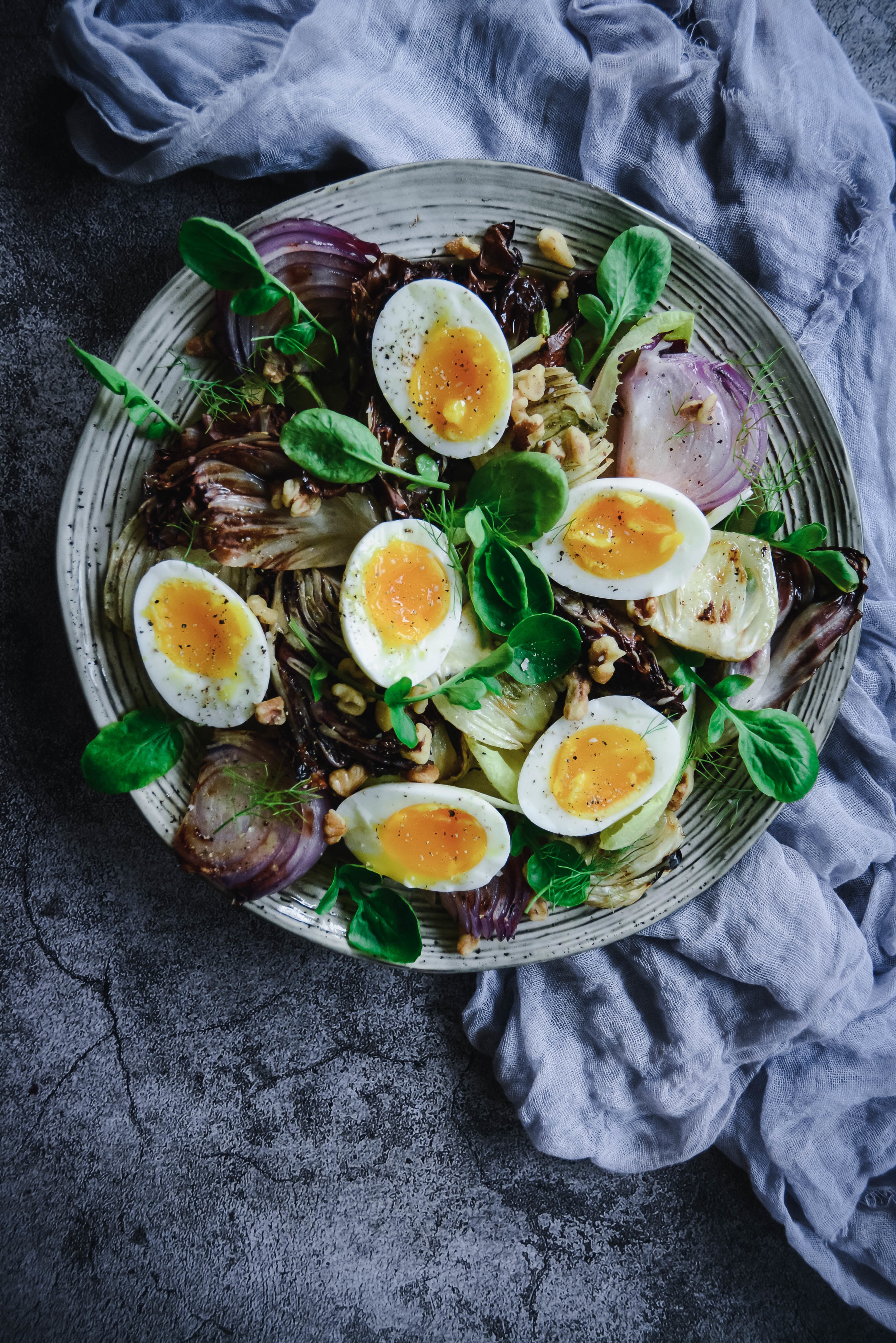  If you’re looking for a delicious salad without the lettuce, check out this grilled radicchio and fennel salad with endives, soft boiled eggs, toasted walnuts and a tangy vinaigrette. It’s simple yet delicious! #paleo #whole30 #vegetarian #calmeats #salad #radicchio #fennel #softboiledeggs #endive #whole30salad #paleosalad #saladrecipe #summerrecipe 