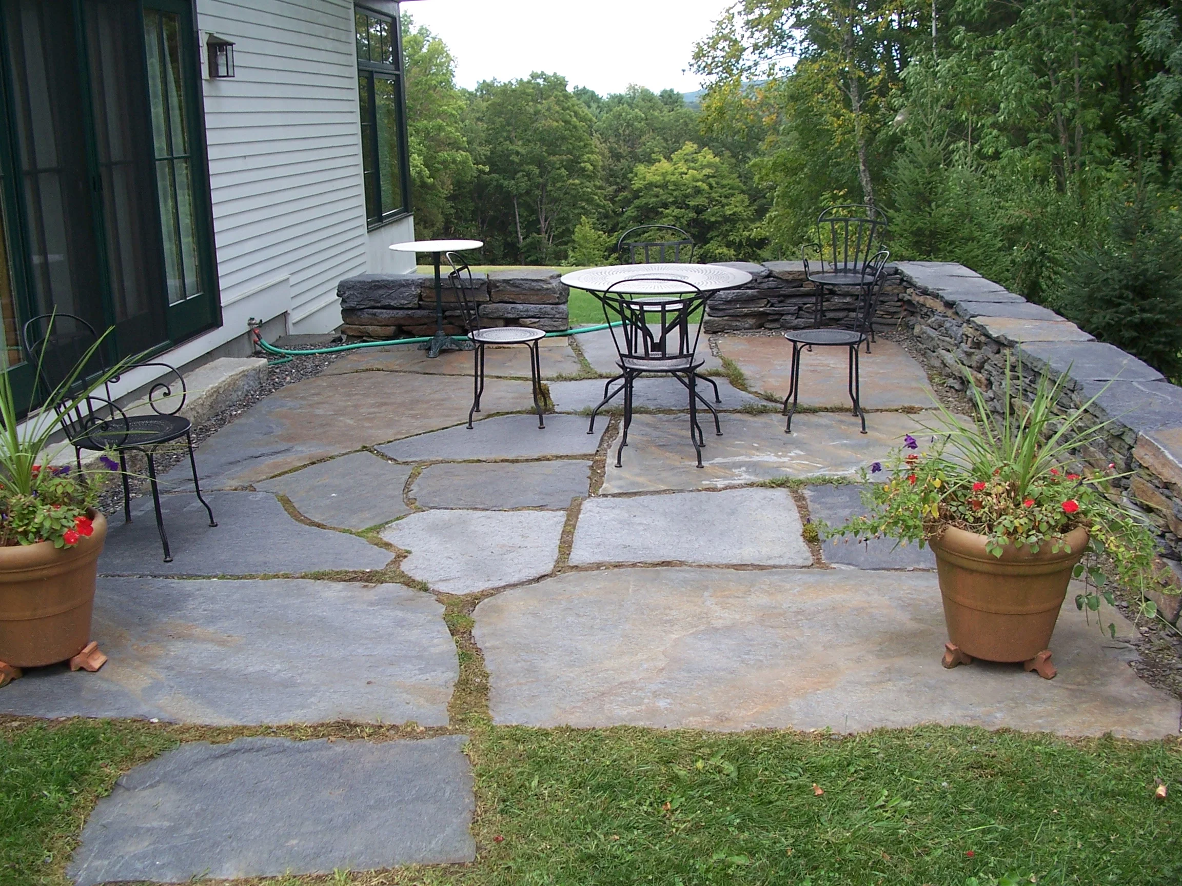 Stone patio and dry stone wall