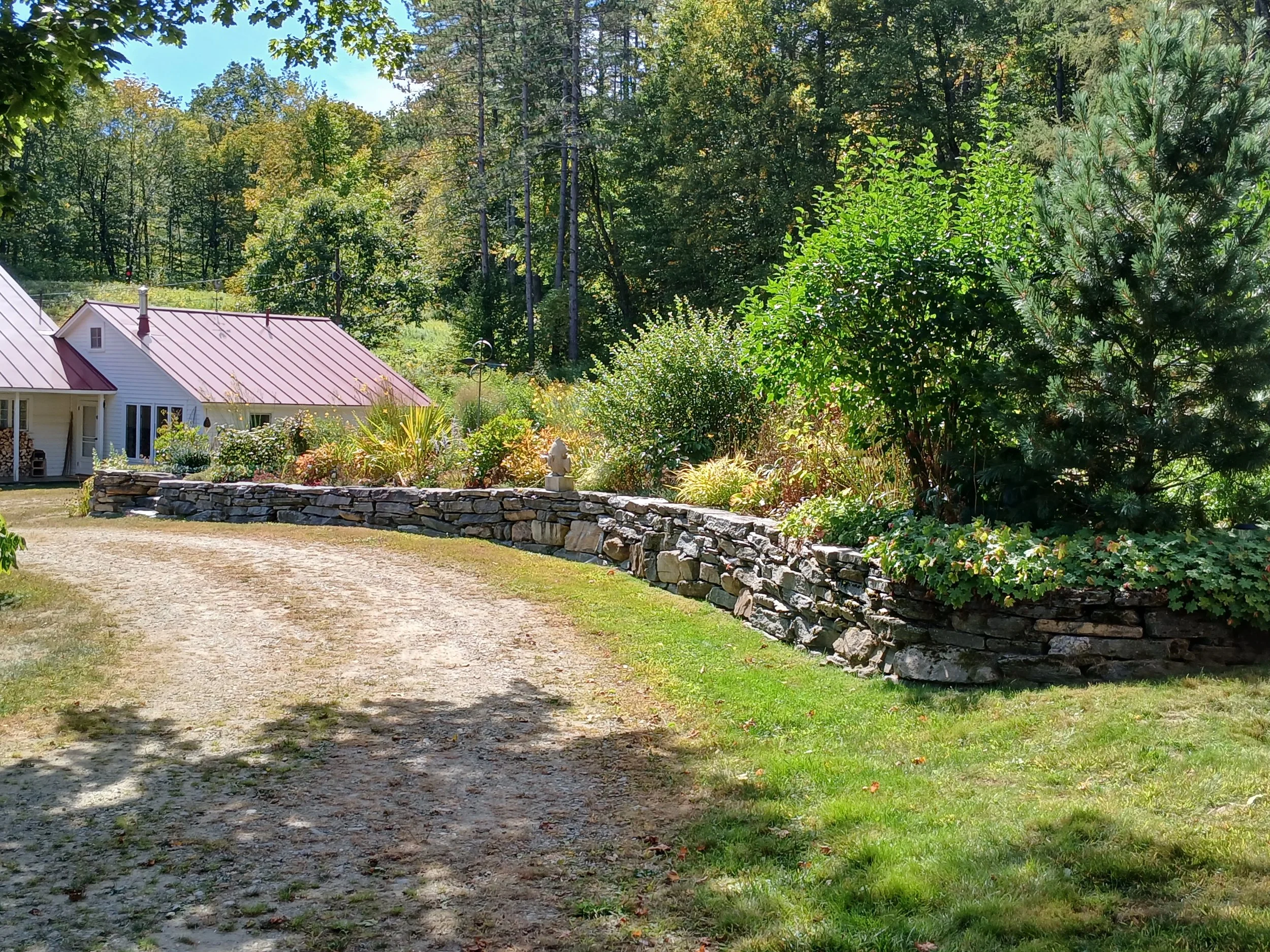 Curving natural stone retaining wall