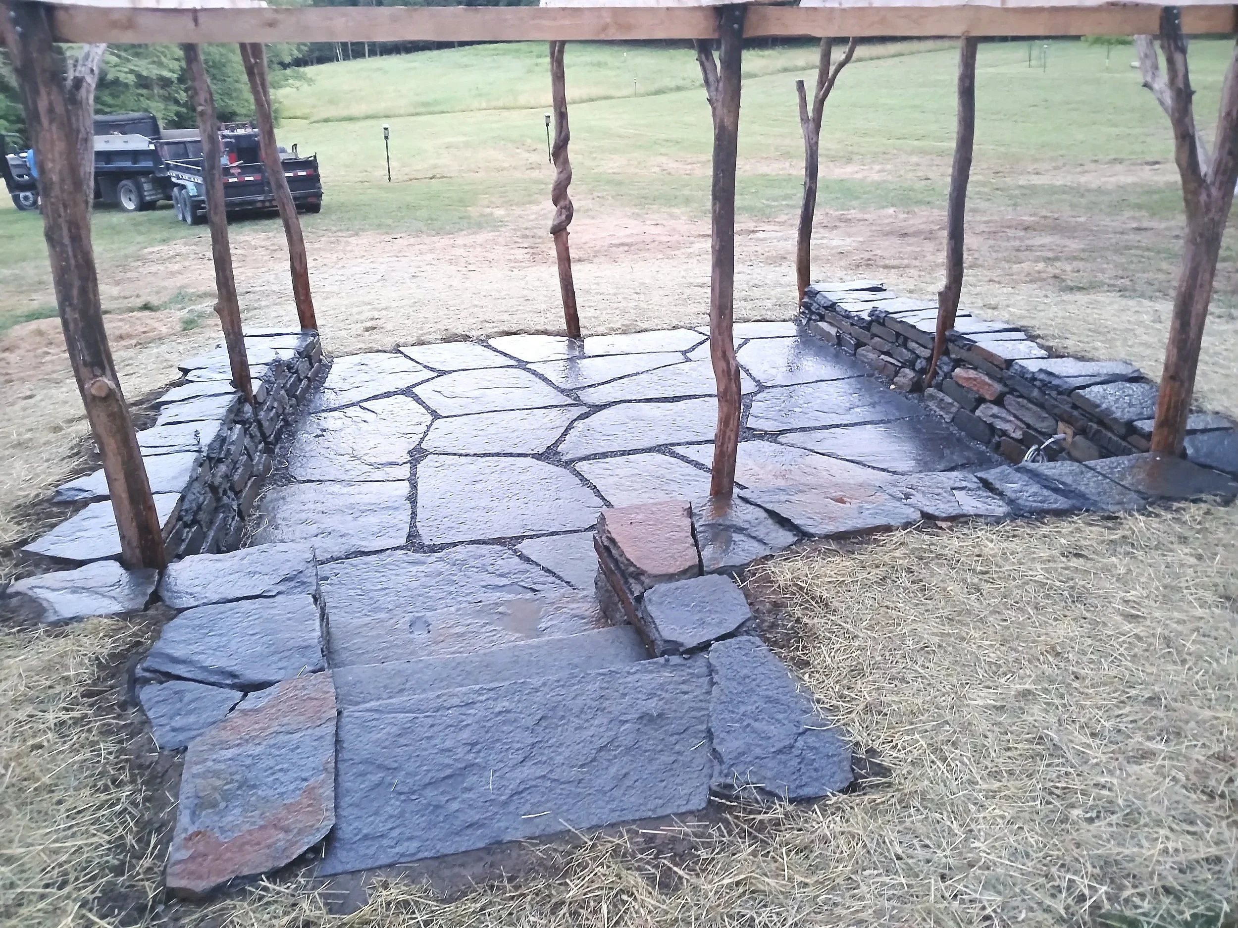 Natural stone patio and stone wall sitting area