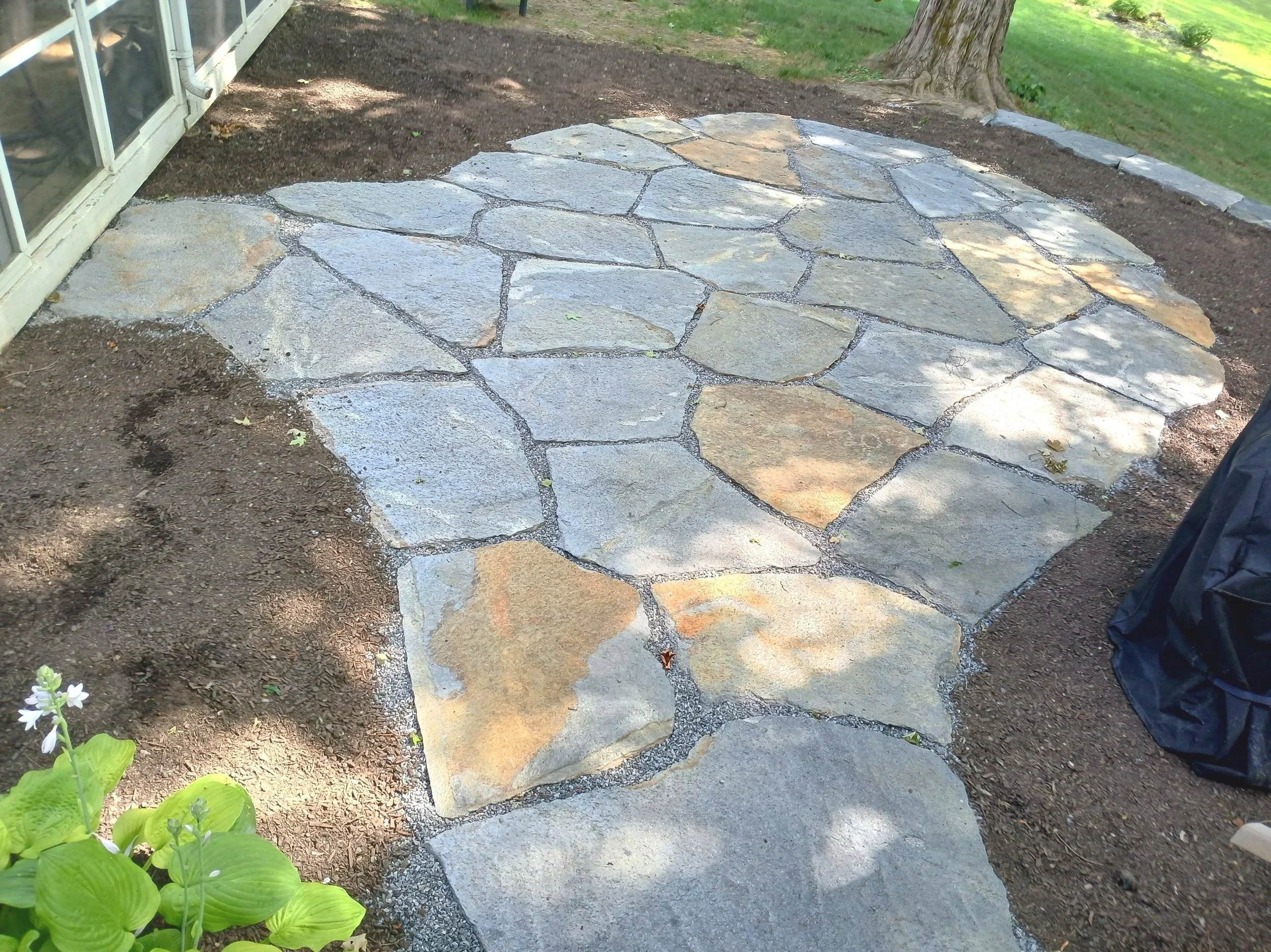 Hand laid natural stone sitting patio