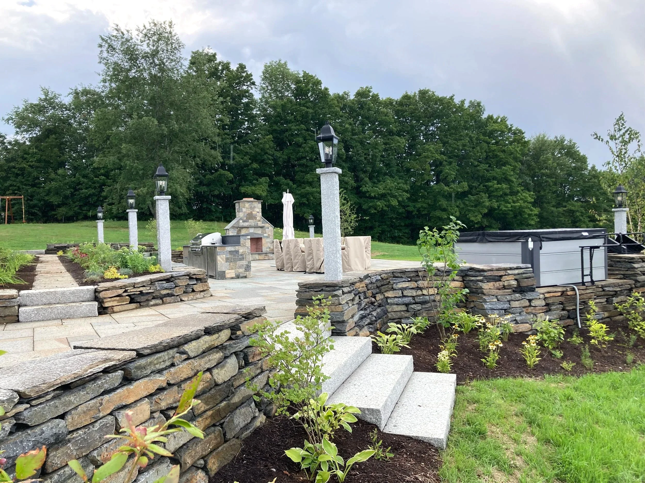 Stone sitting walls and bluestone patio