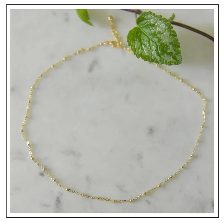 Essentials Satellite_Chain_Gold_Framed.jpeg