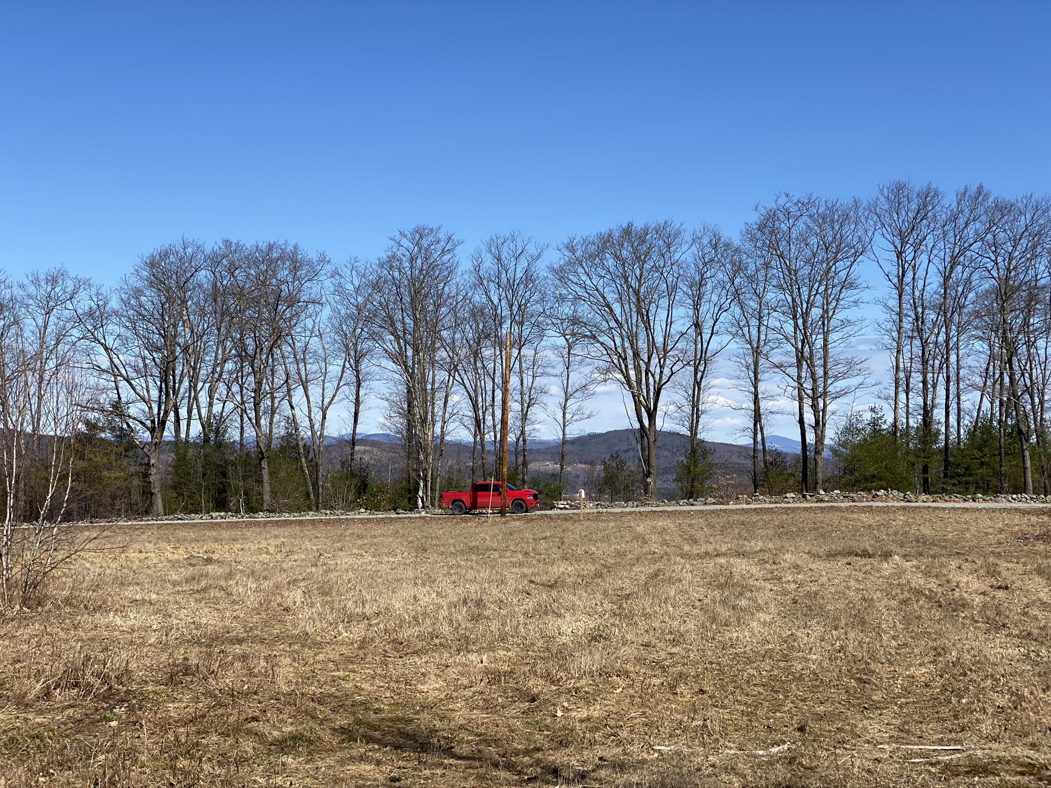 Photo taken while standing on the lot looking across the road at Lot 5's mountain view. 