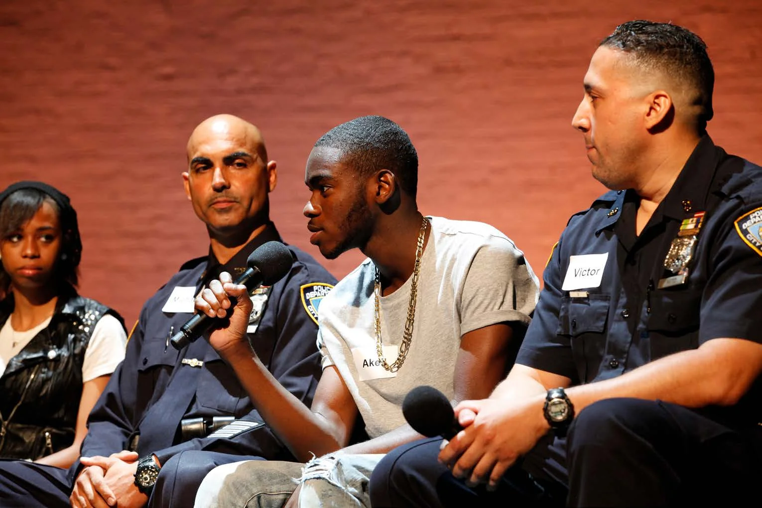 Operation Conversation: Cops & Kids demonstration workshop at the Apollo Theater, August 2014. (From left) Starshima Trent, Officer Michael Murdock, Akeil Davis, and Officer Victor Ramos. (Photo by Kenneth Pietrobono)