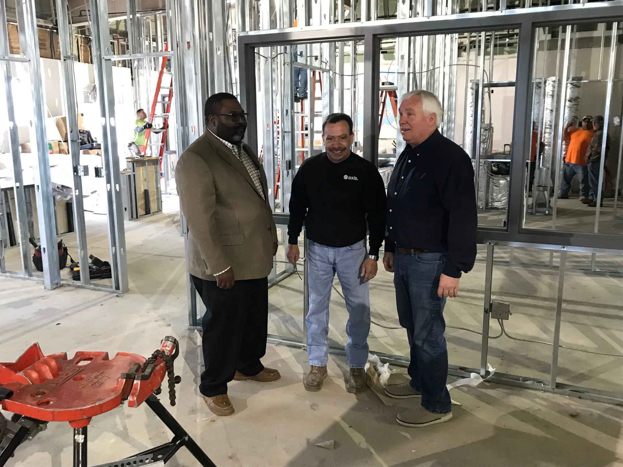 Joseph’s House Executive Director James Wynn, Axis Job Superintendent Dan Barges and Board Member John Klein inspect progress.