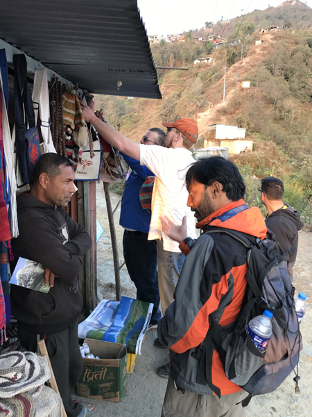 Reaching a shopkeeper in Pokhara.JPG