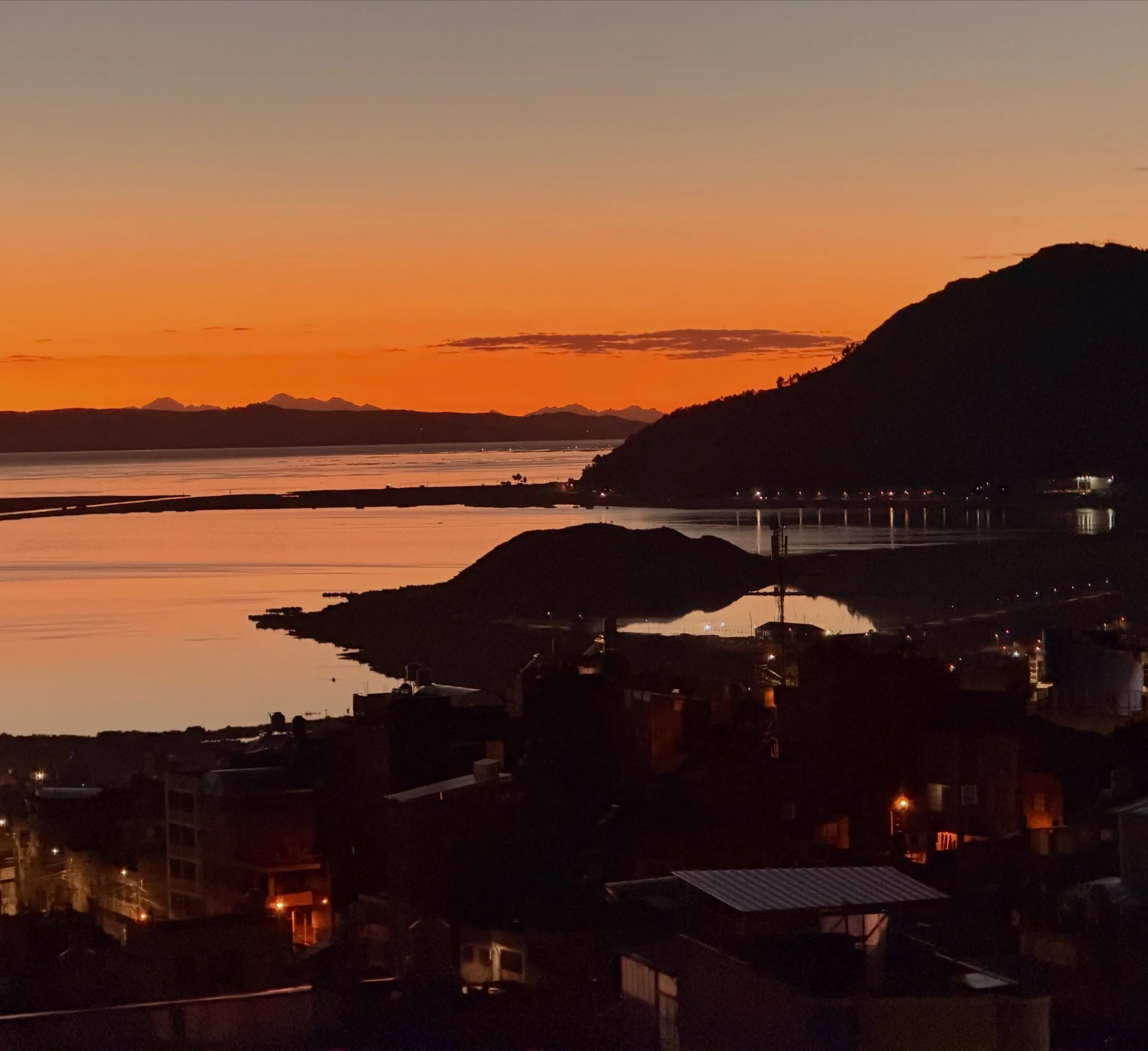I never tire of the beautiful sunrises here as seen from the kitchen window of a 4th floor apartment. Those high mountains in the far distance, as seen on this cloudless morn, are the same ones we could see so up-close while walking with the Cross in