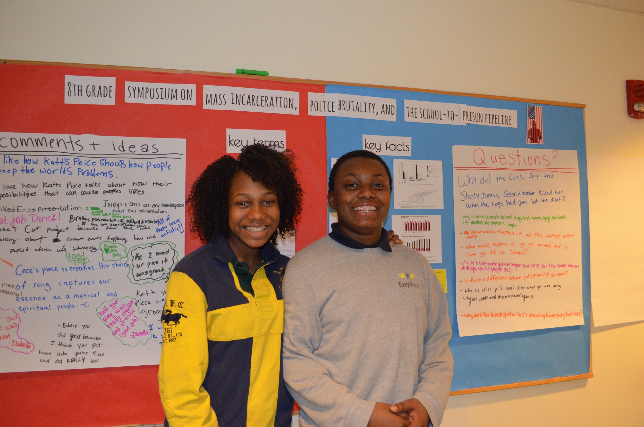 Catenzia and Jovan posing in front of the questions asked by the school