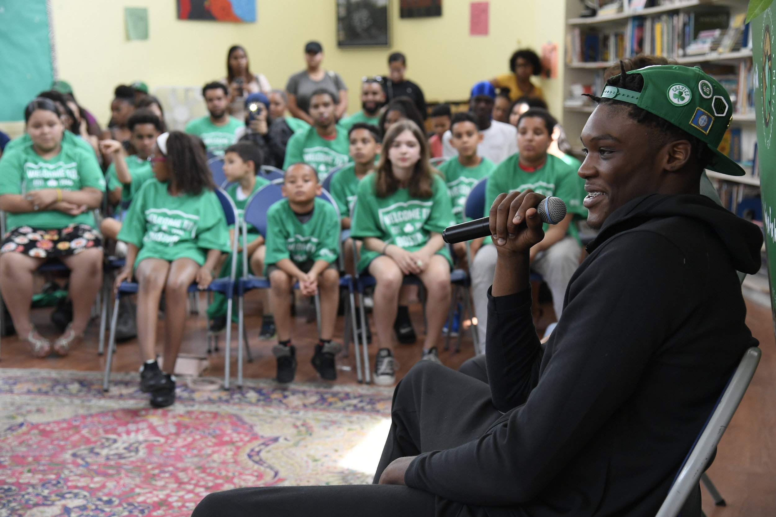   Robert Williams, the 2018 Celtics Rookie, speaking to students during an assembly  