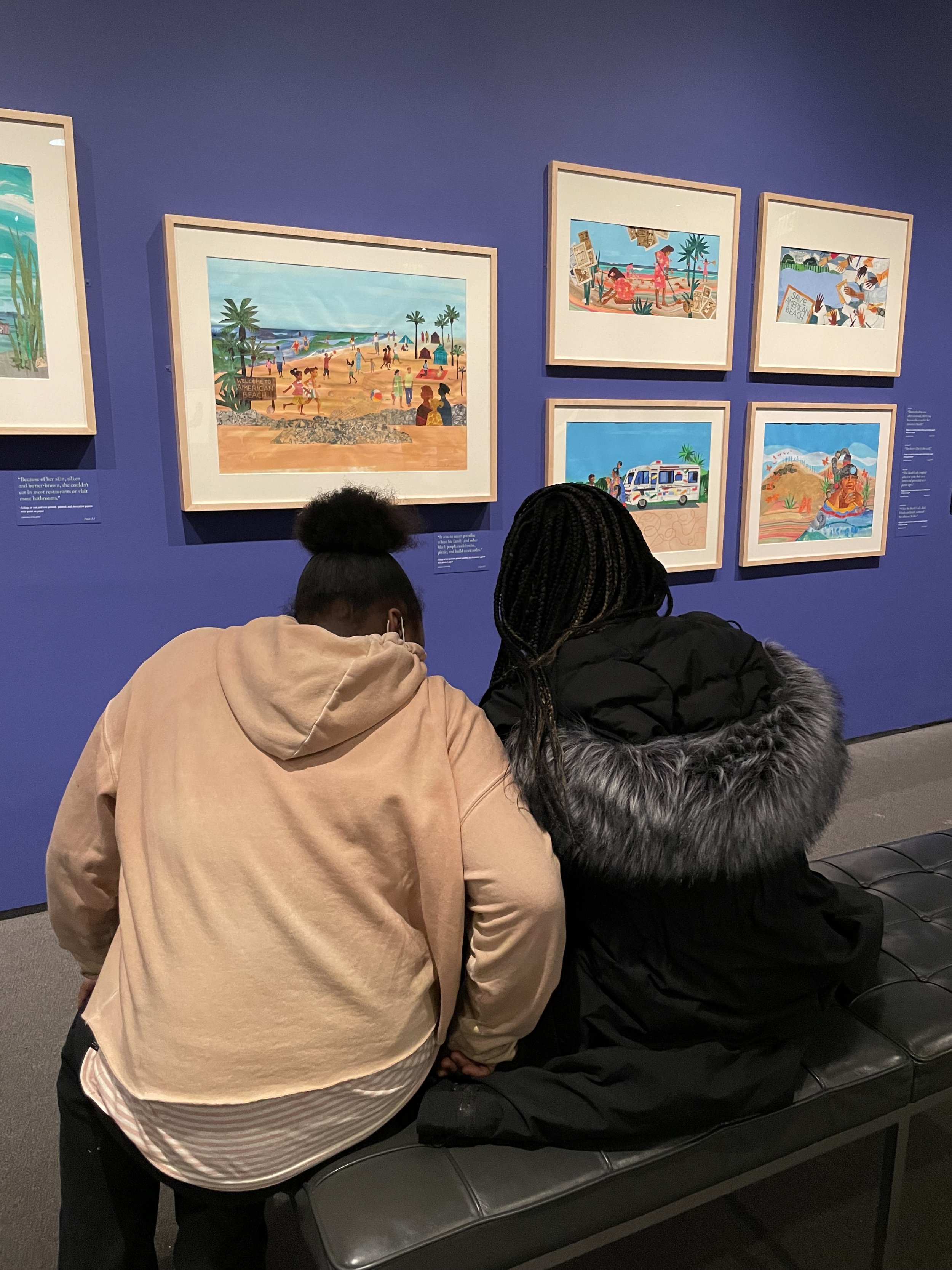    Dalila and Harmony observing the art.   