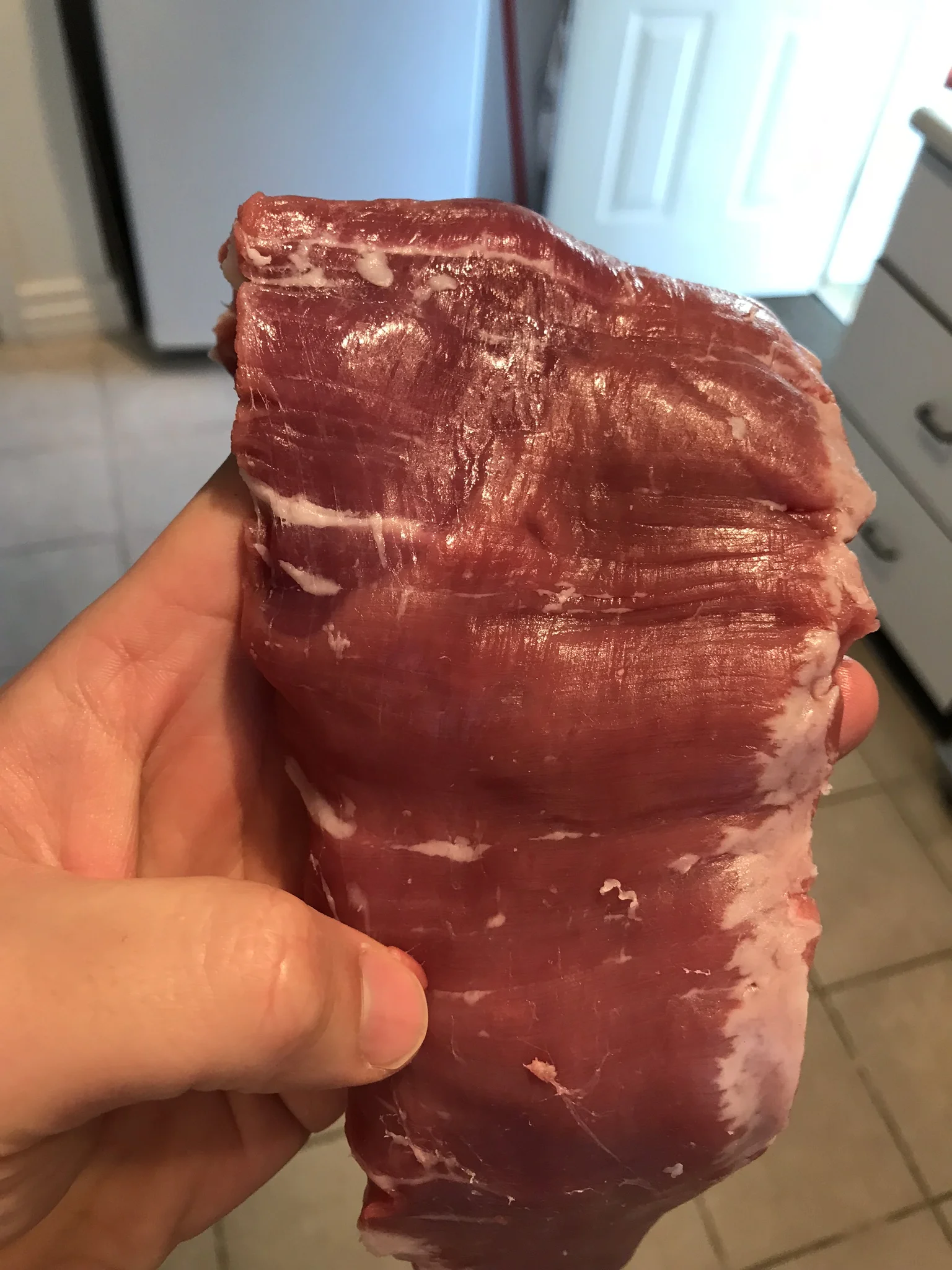 Note the striations of the fibre of the muscle. It's important to notice which way it's running so you know which way to cut after cooking. You always want to cut against the grain, never with it.... or you'll have chewy meat string and everyone will hate you forever.