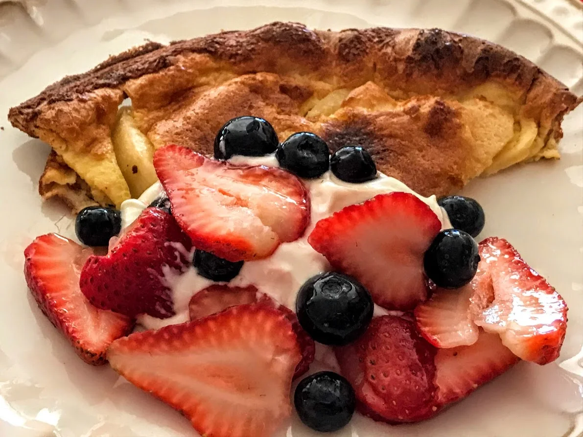 Apple Dutch Baby with Strawberries, Blueberries, and Yogurt