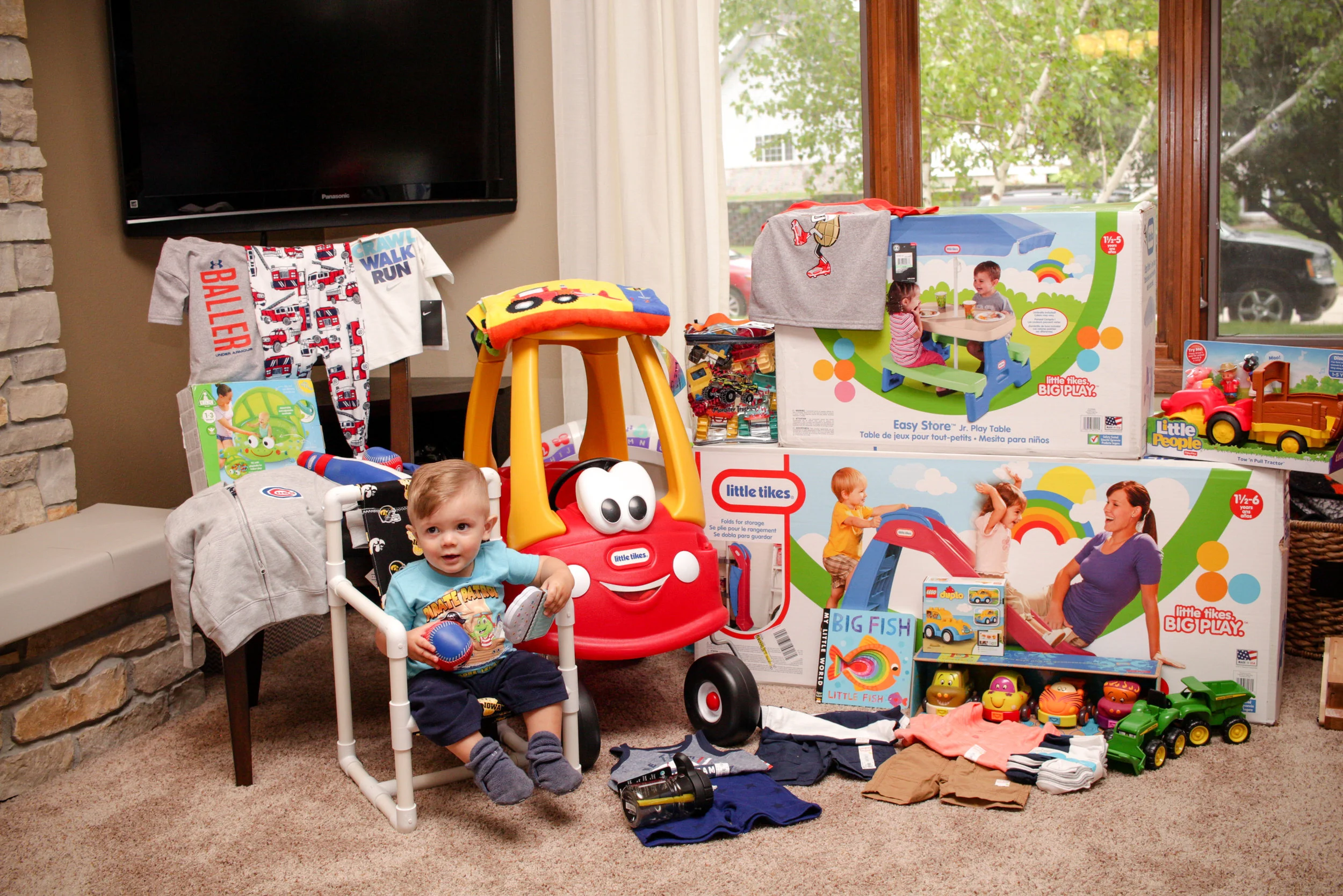 I think it's safe to say he made out pretty well in gifts for his first party! He especially enjoyed sitting in his new chair and scooting around in his red and yellow car. 