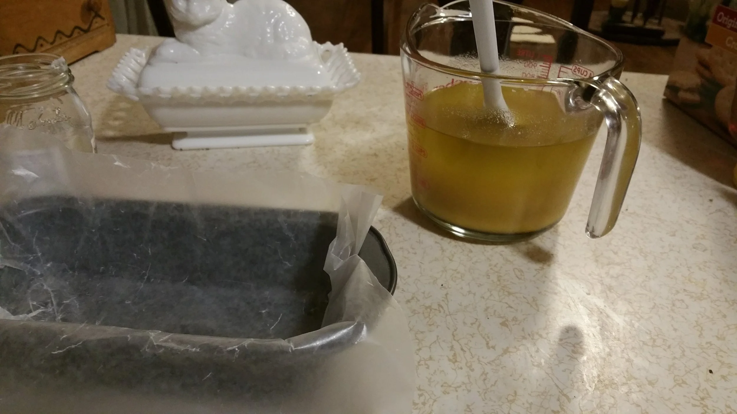 When I first made soap I was hand mixing, but it took a long time. I used improvised molds such as this loaf pan lined with parchment paper.