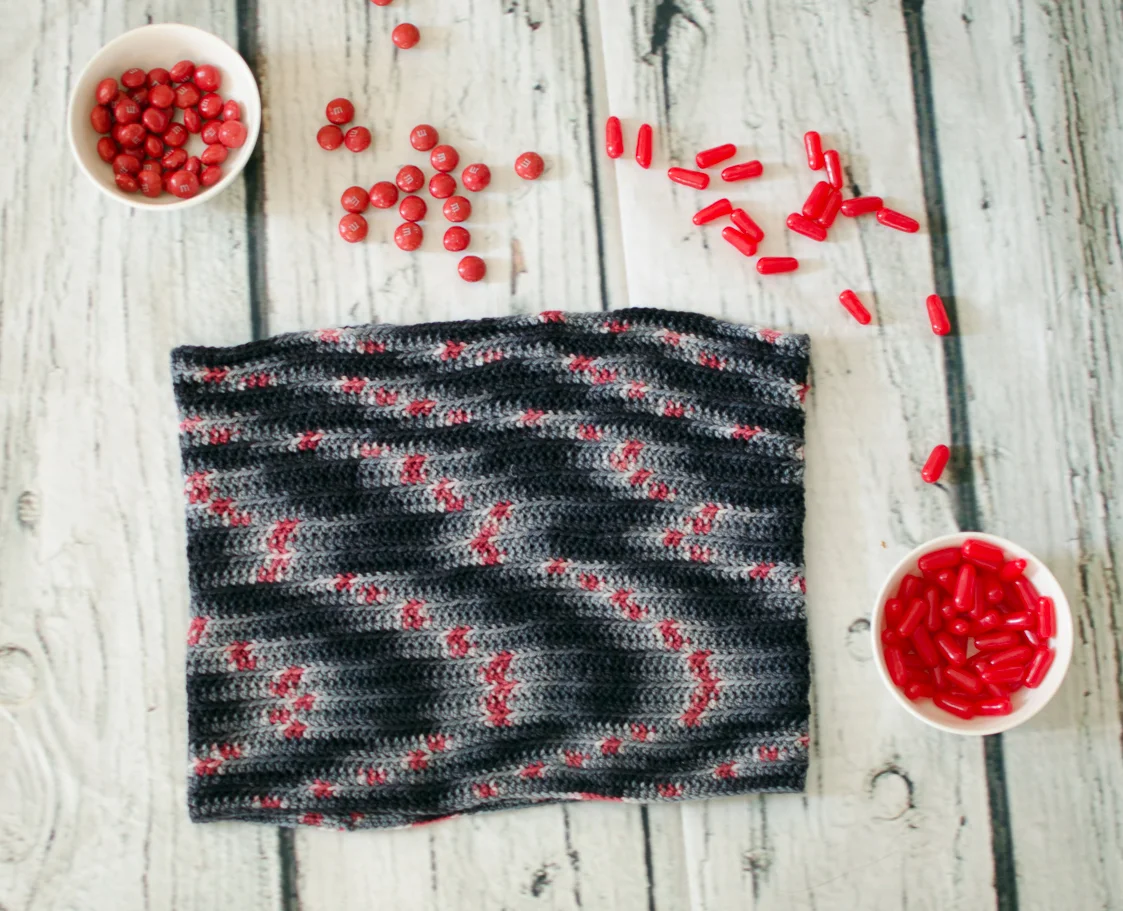 The Groovy Crocheted Cowl uses just 1 skein of Delicious Yarns Sweets Sport (shown here in Black Cherry) to whip up this one-size-fits most accessory. 
