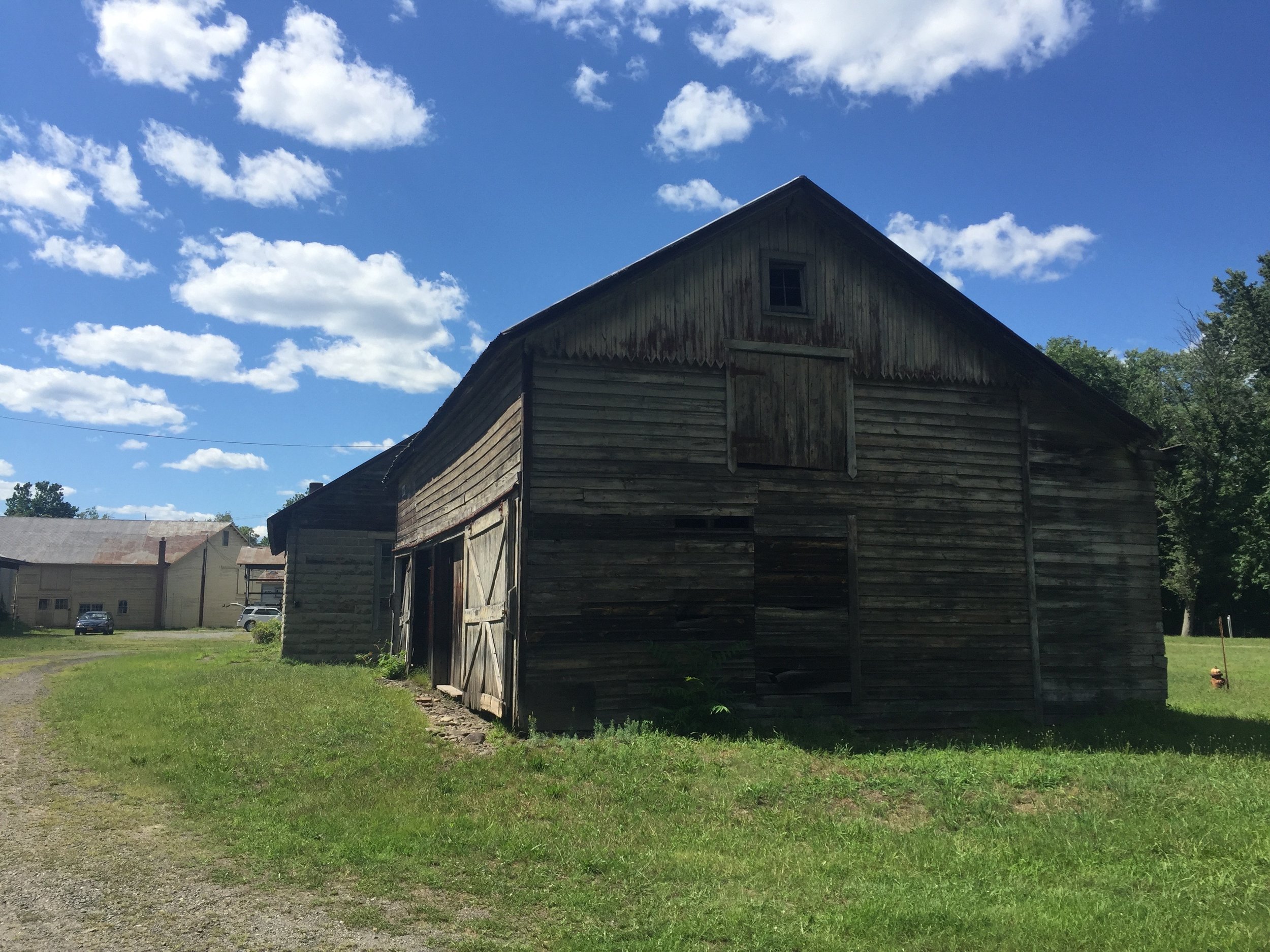Old sheddy needs even more work than the garage and for serves as storage for the local theater company.